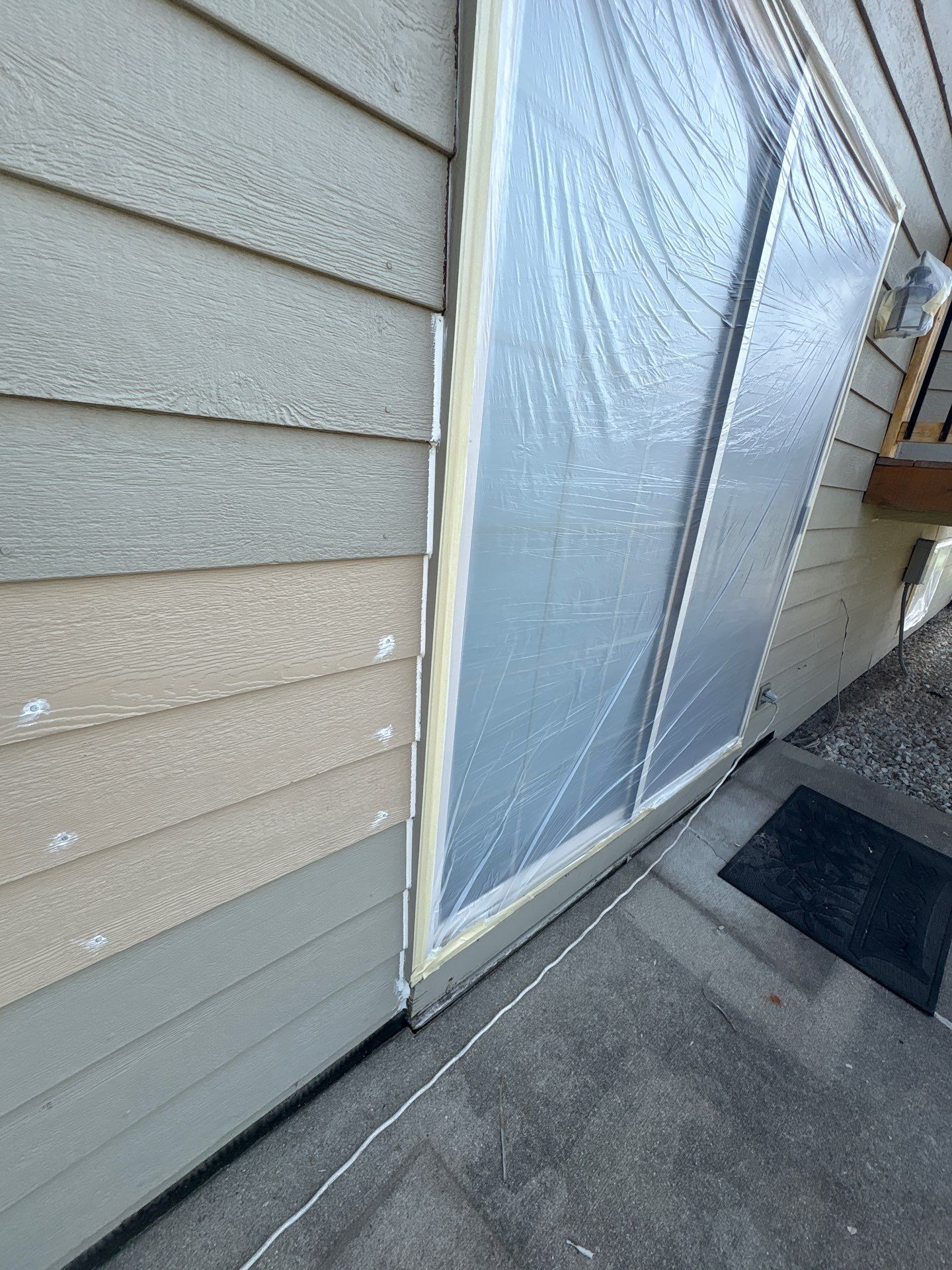 Residential Exterior Painting and Siding Refresh in Sioux Falls by Select Painting, Coatings & Garage Cabinets