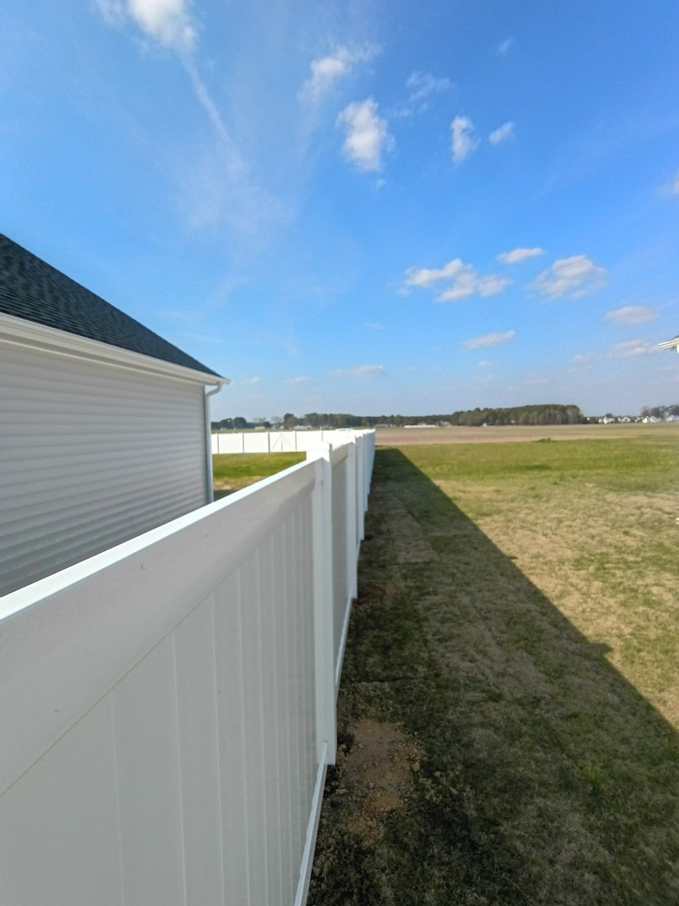 White Vinyl Privacy Fence Installation in Ayden, North Carolina by Superior Fence and Rail