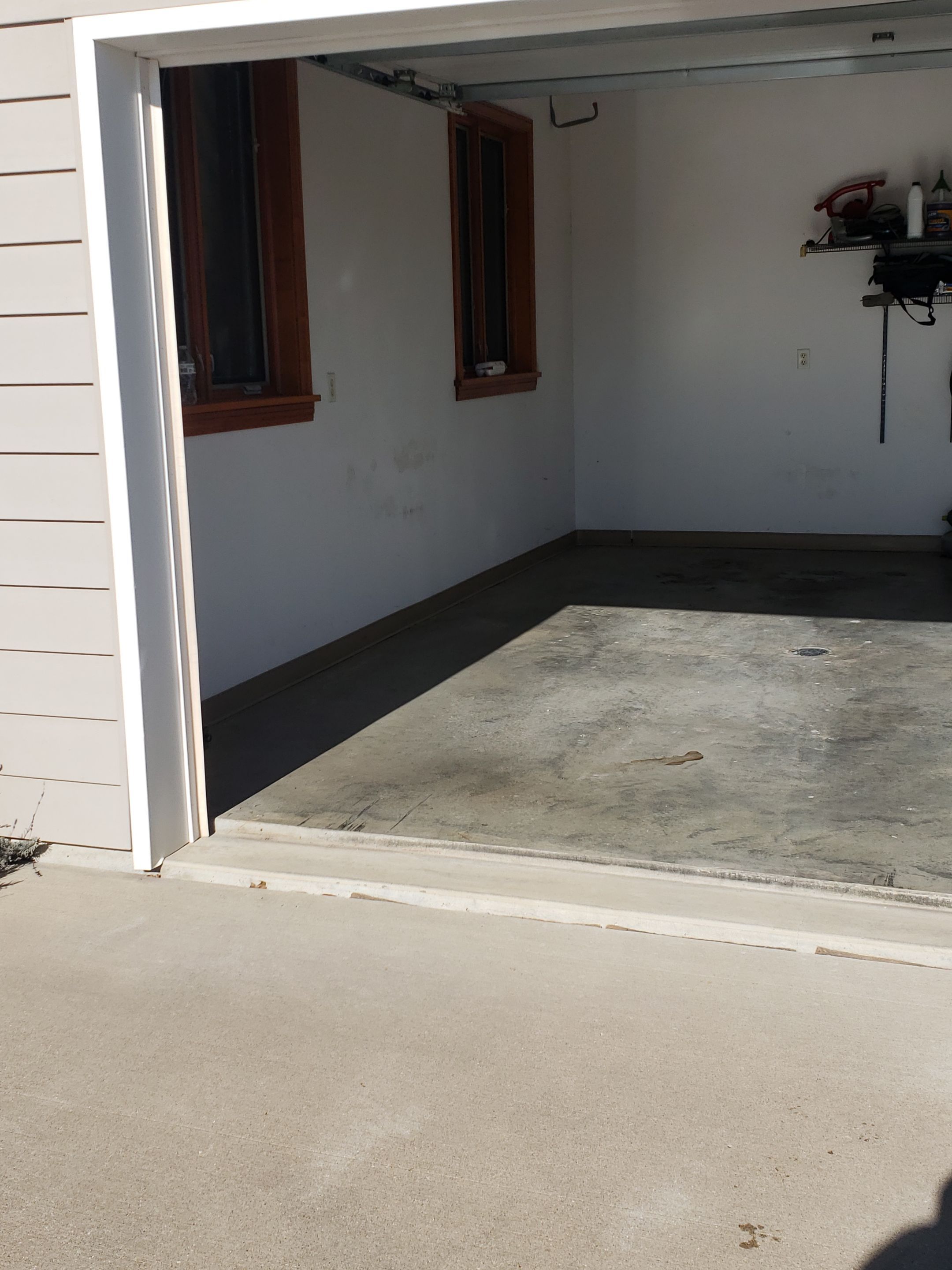 St. Joseph -- Front Patio and Garage Epoxy Garage Coating System by Big Red Decorative Concrete, LLC