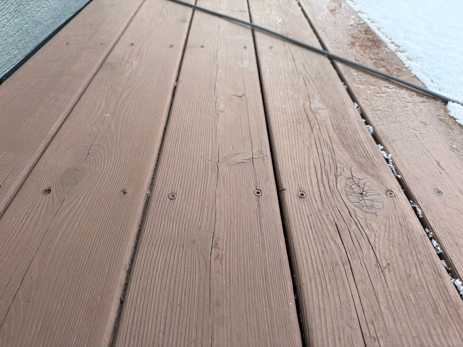 Madison Exterior Remodel with Dark Gray Siding and Stone Accents by Select Painting, Coatings & Garage Cabinets