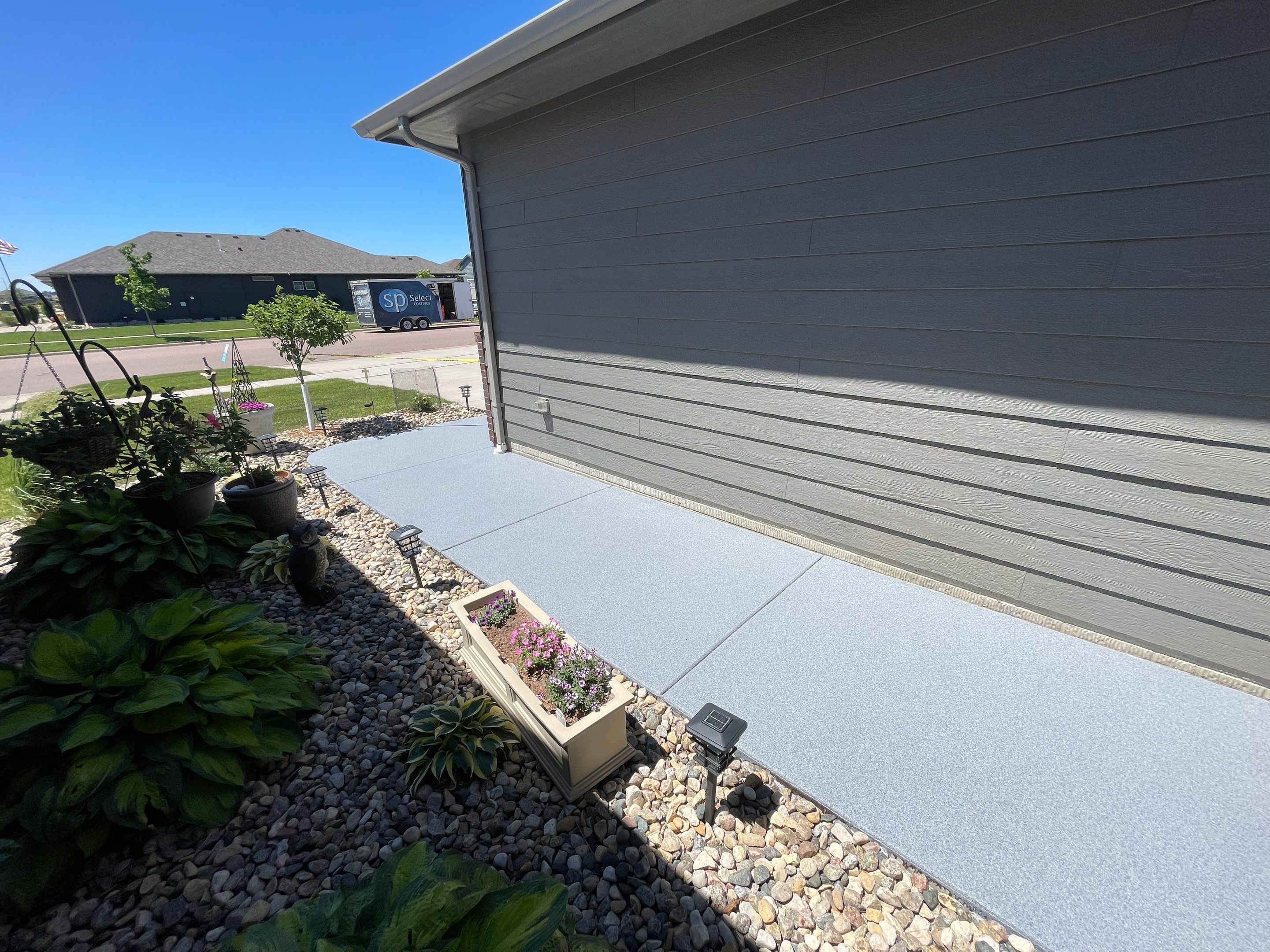 Custom Concrete Coating for Sioux Falls Patio and Front Walkway by Select Painting, Coatings & Garage Cabinets