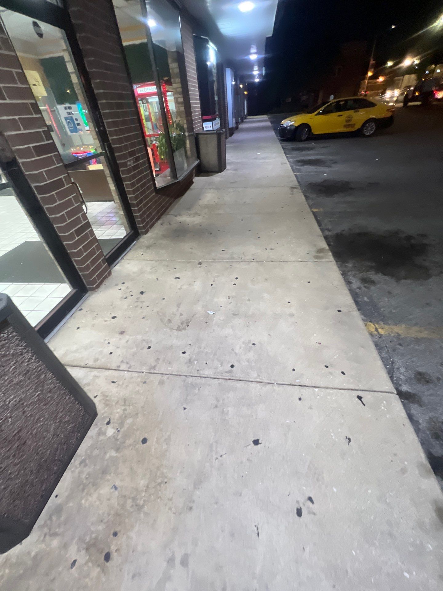Commercial sidewalk cleaning. by Northern Power Washing LLC.