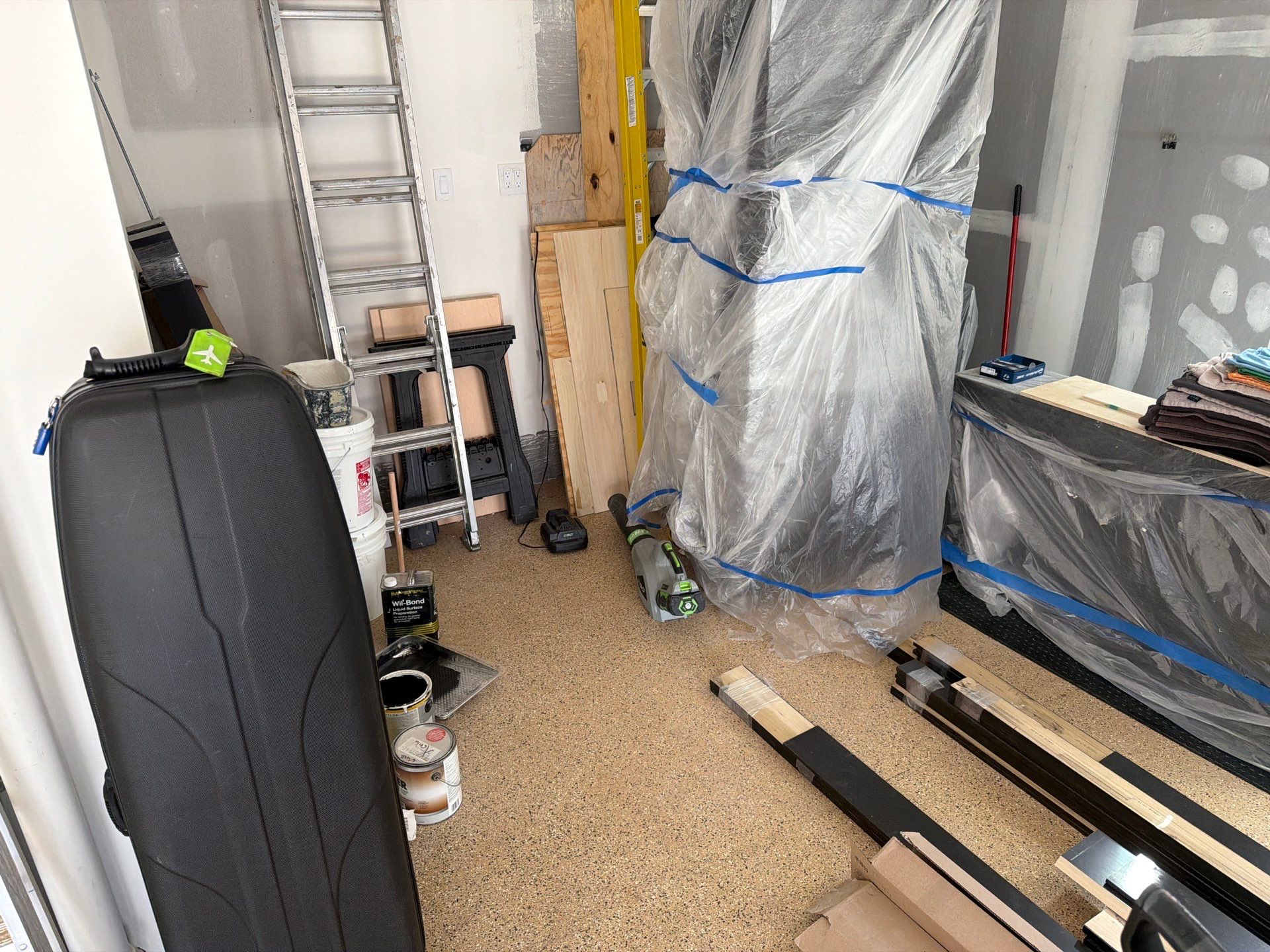 Gray Speckled Epoxy Garage Floor Coating in Sioux Falls by Select Painting, Coatings & Garage Cabinets