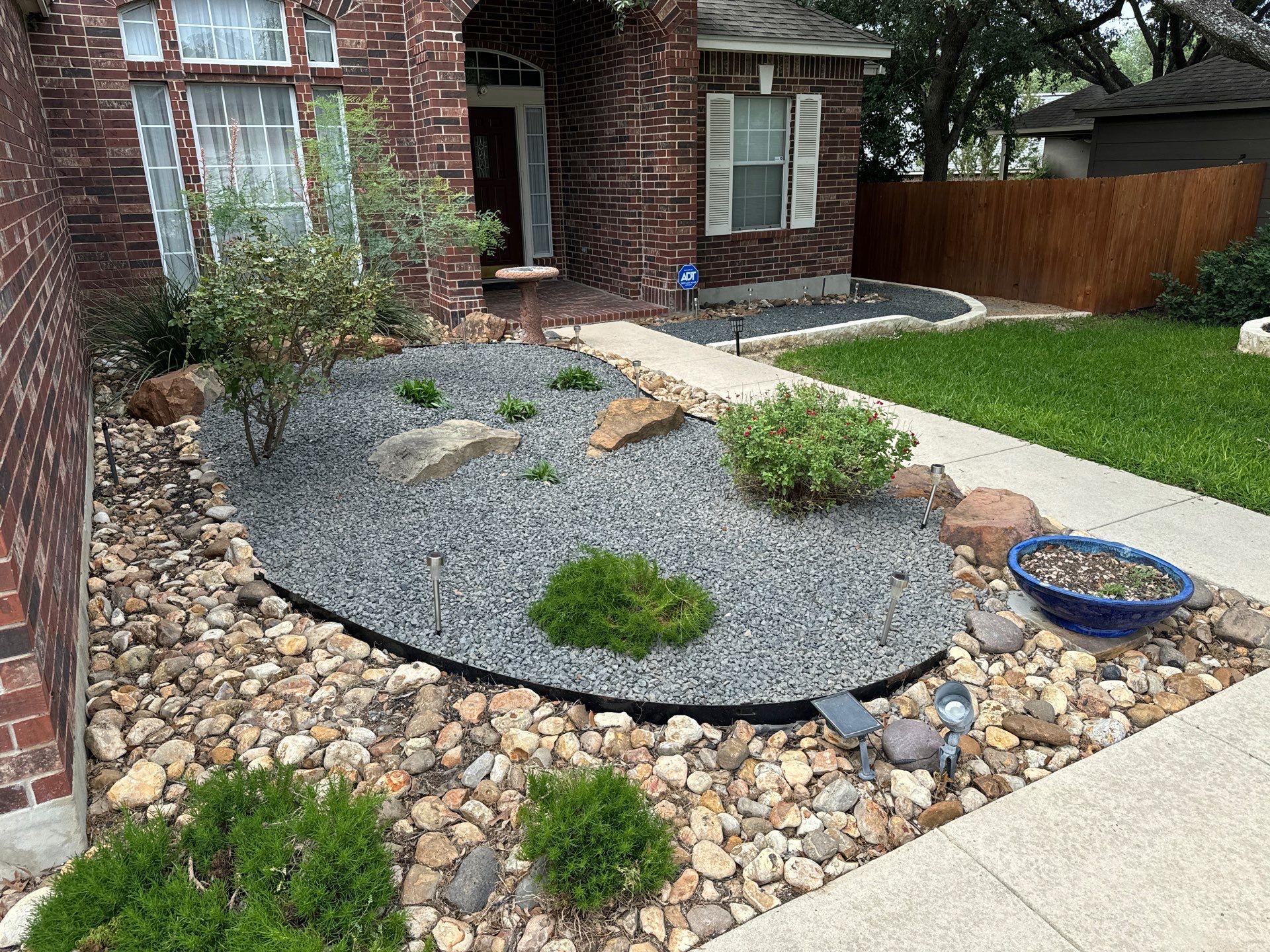 Landscaping Enhancement  using Texas Black Gravel by Hole In One Lawns, LLC