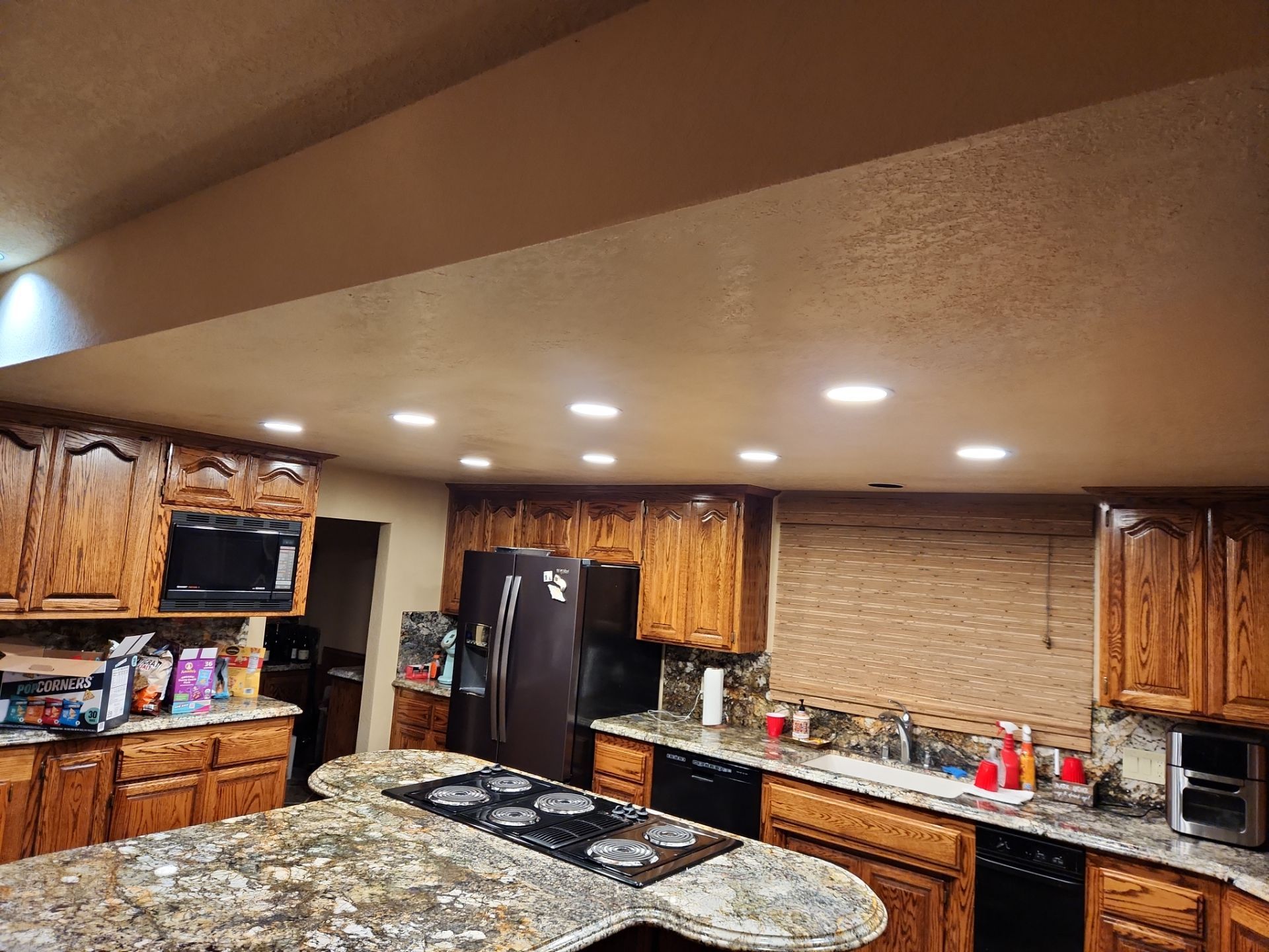 Kitchen Lighting/Siding Repair by The Tahoe Tradesman
