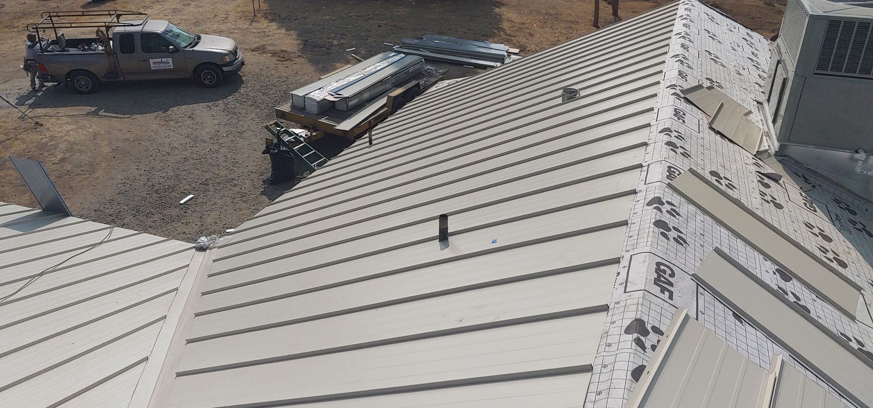 Residential Roofing Installation using Standing seam metal roofing system by Straight Edge Roofing Inc