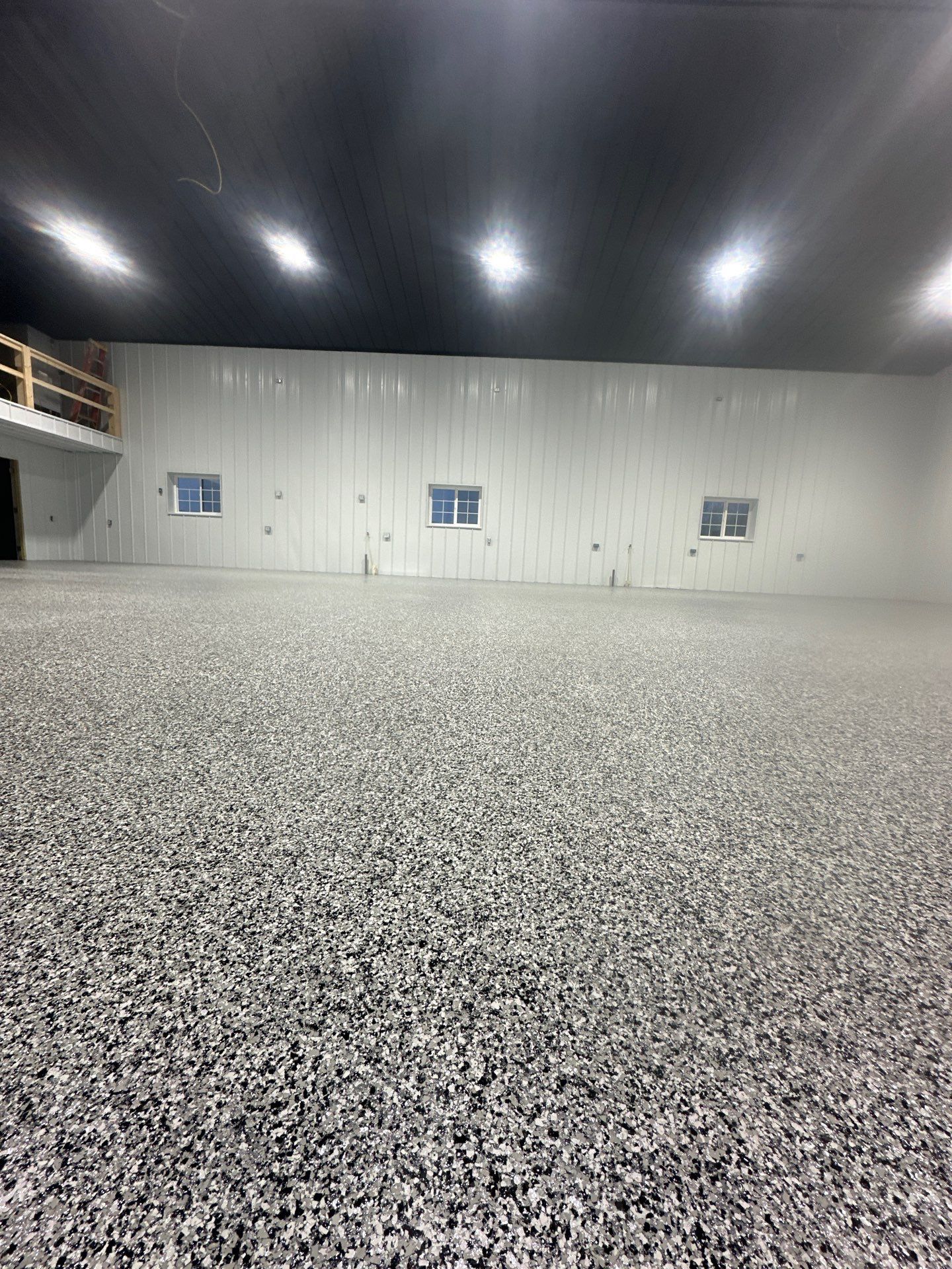 Barndominium Flake Coating using Polyaspartic by Revival Concrete Coatings
