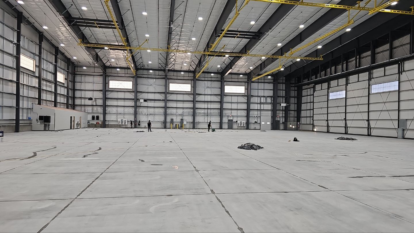 Airplane Hanger using Light Grey Commercial Penntek Epoxy by Croc Coatings, LLC