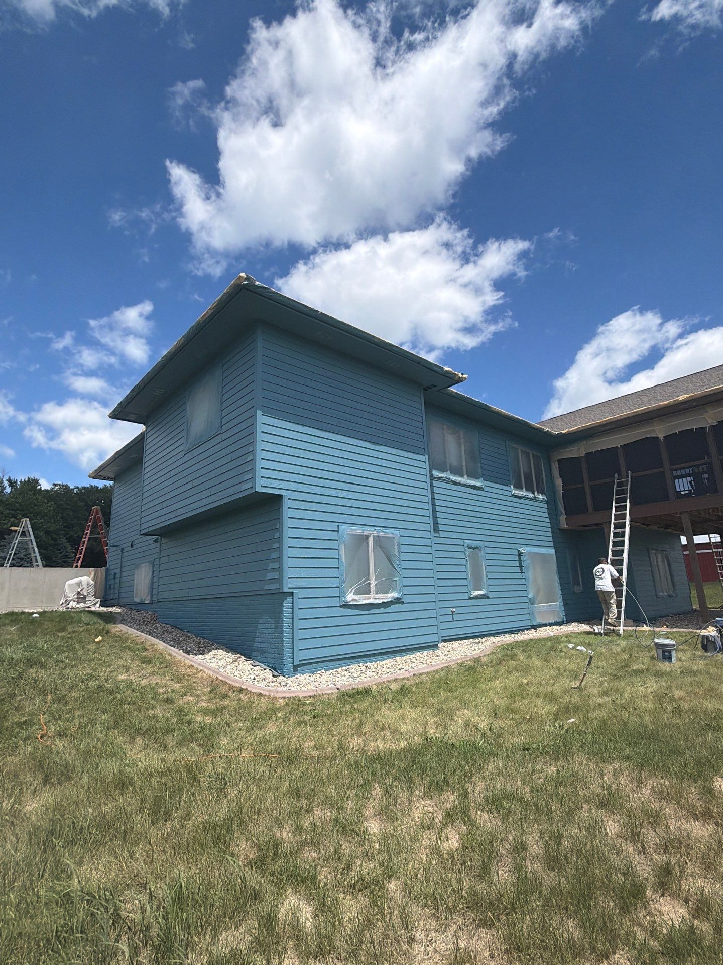 Full Exterior Siding Paint Restoration and Refresh in Garretson by Select Painting, Coatings & Garage Cabinets