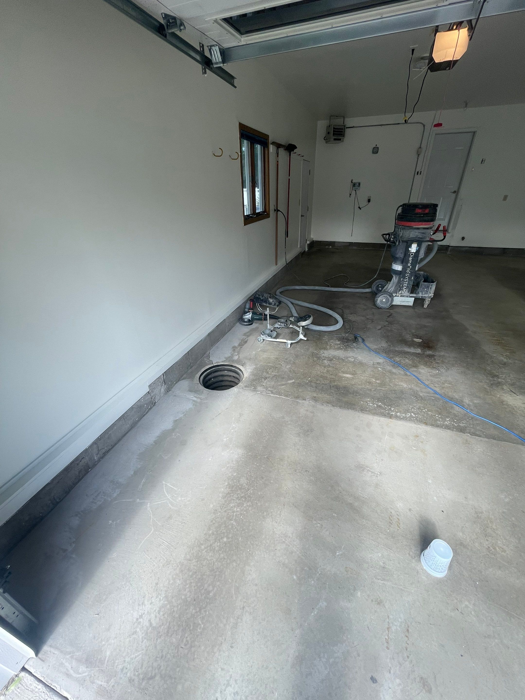Madison Garage Concrete Coating with Feather Grey Speckle Finish by Select Painting, Coatings & Garage Cabinets