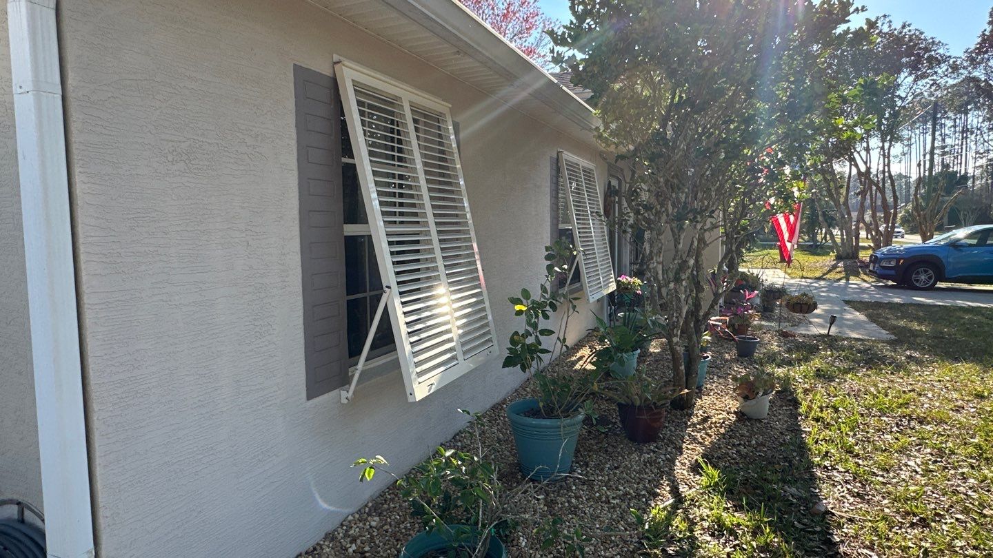 Hurricane Rated Bahama Shutters in Cream by Smart Guard Shutters