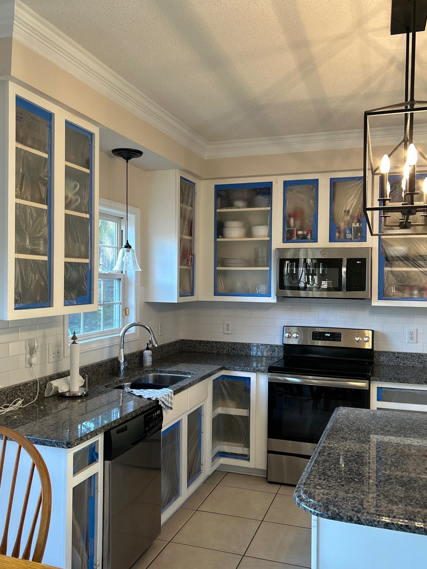 Cabinet painting by GonzalezPainters & Contractors Inc 