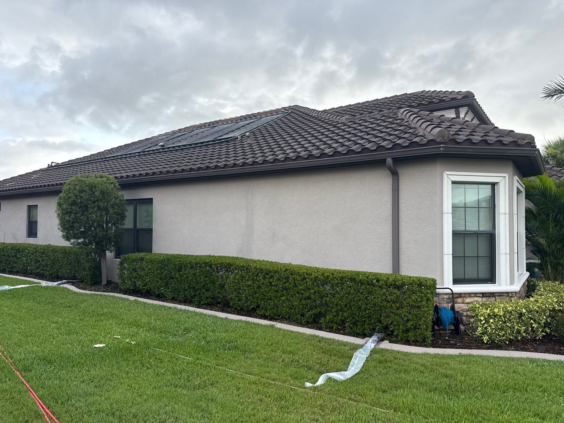 Neighboring Tile Roof Cleaning with Gutter Runoff Control – Palmetto, FL by Sunshine AquaWash
