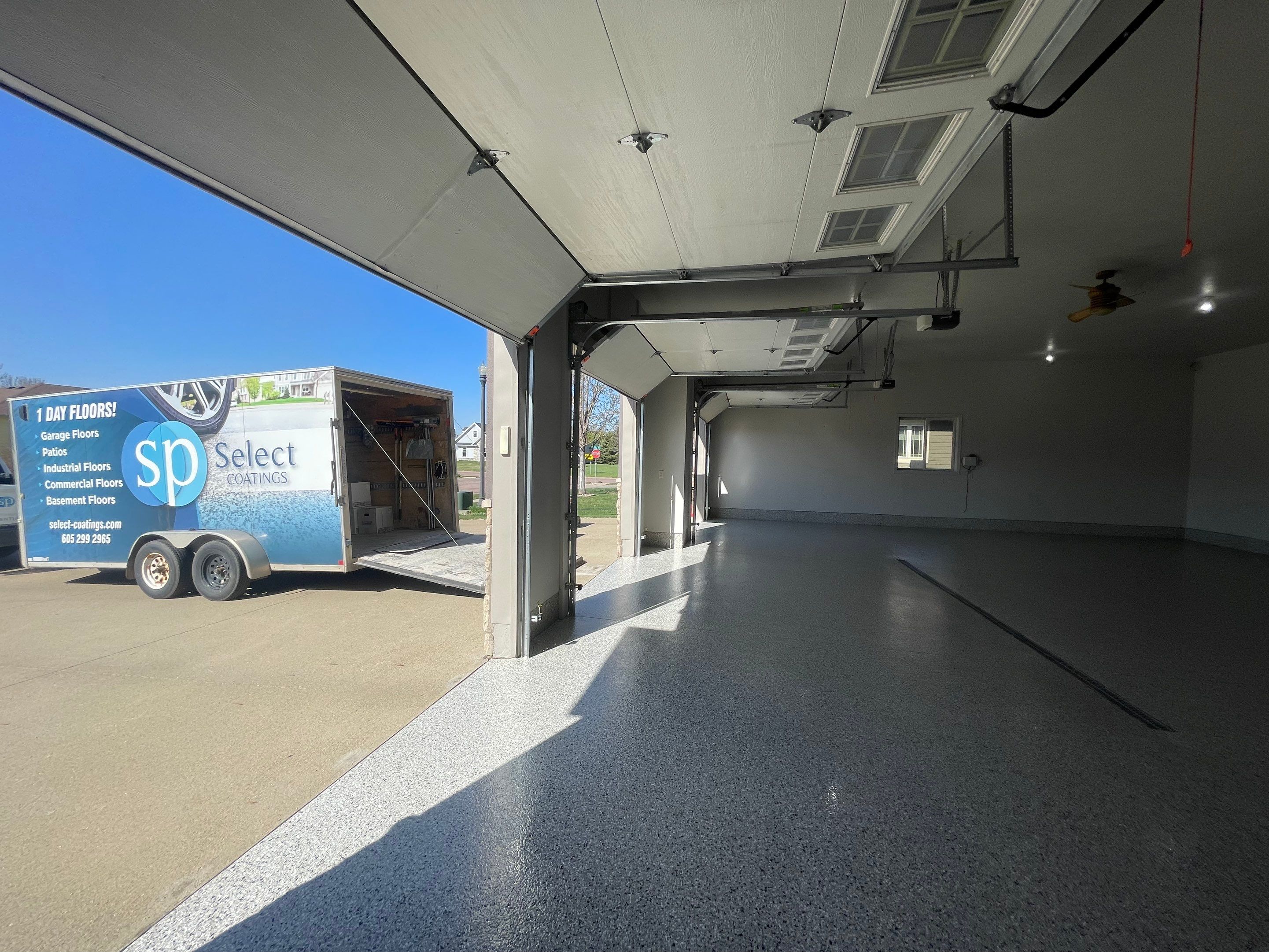 Multi-Car Garage Epoxy Floor Coating in Beresford by Select Painting, Coatings & Garage Cabinets