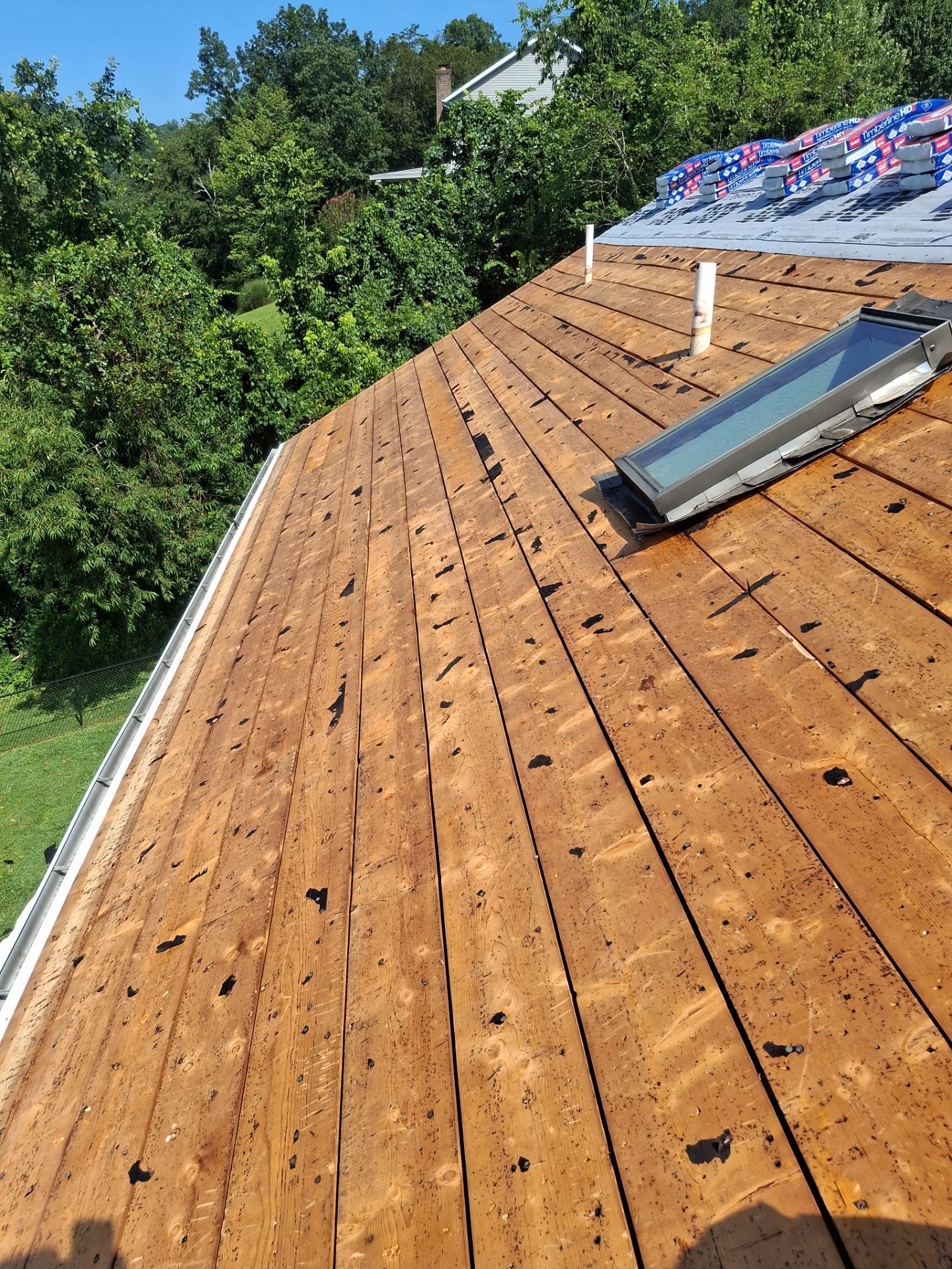 Residential Roofing Installation using GAF Timberline HDZ Charcoal by Rainstoppers Roofing