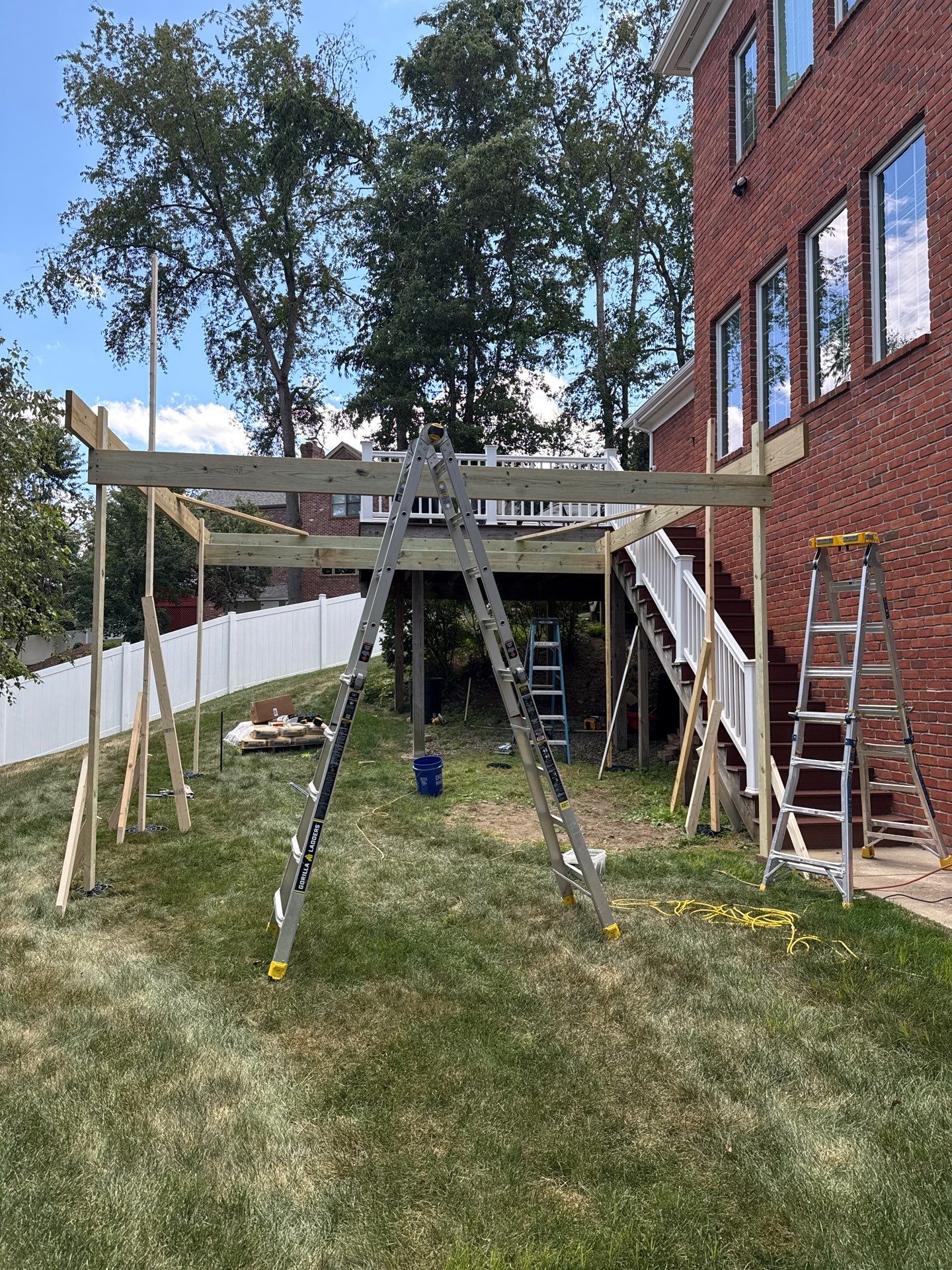 Deck extension  by Cousins Roofing Siding & Decks