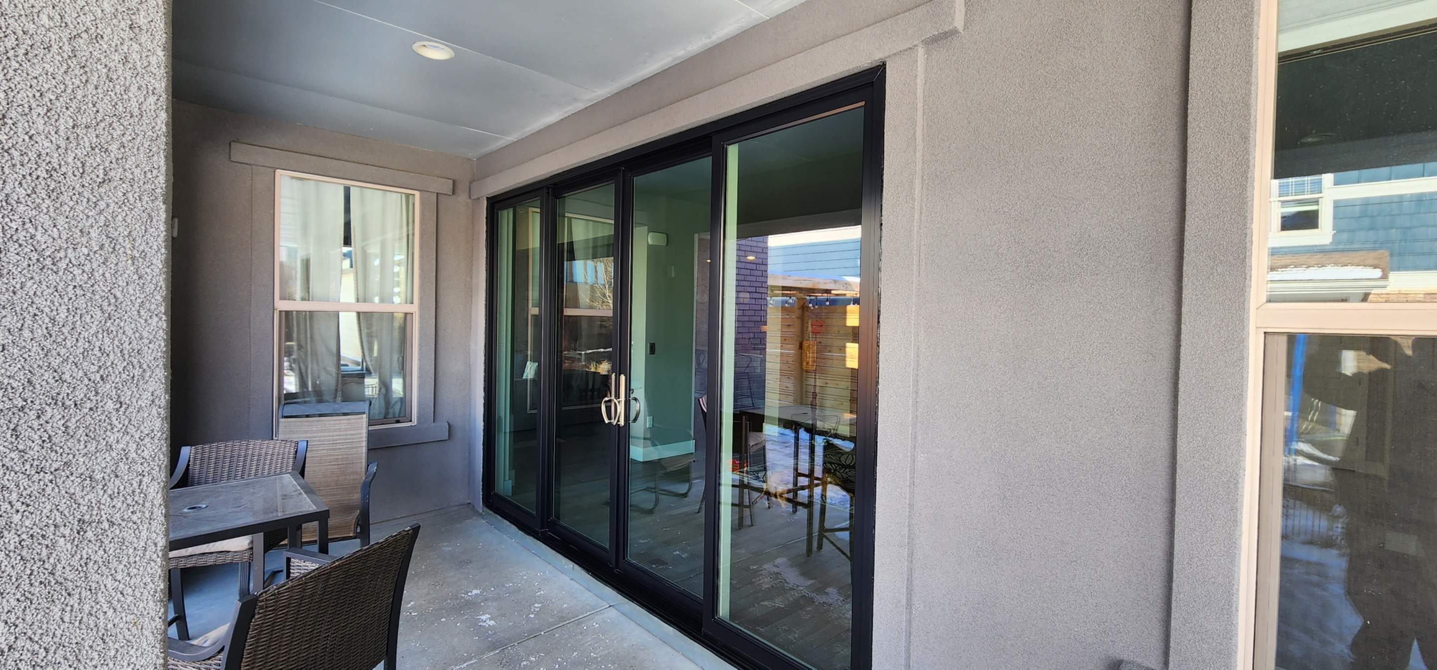 Open your space up to the outside! 4 Panel Patio door replacing 2 windows by 1st choice windows and siding