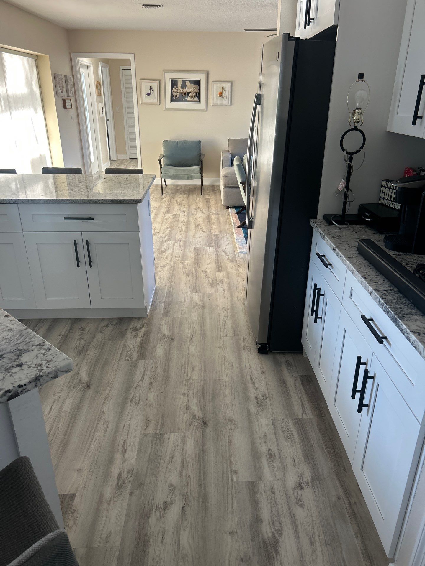 LVP Install in living room/ Kitchen by Vrmmm Flooring