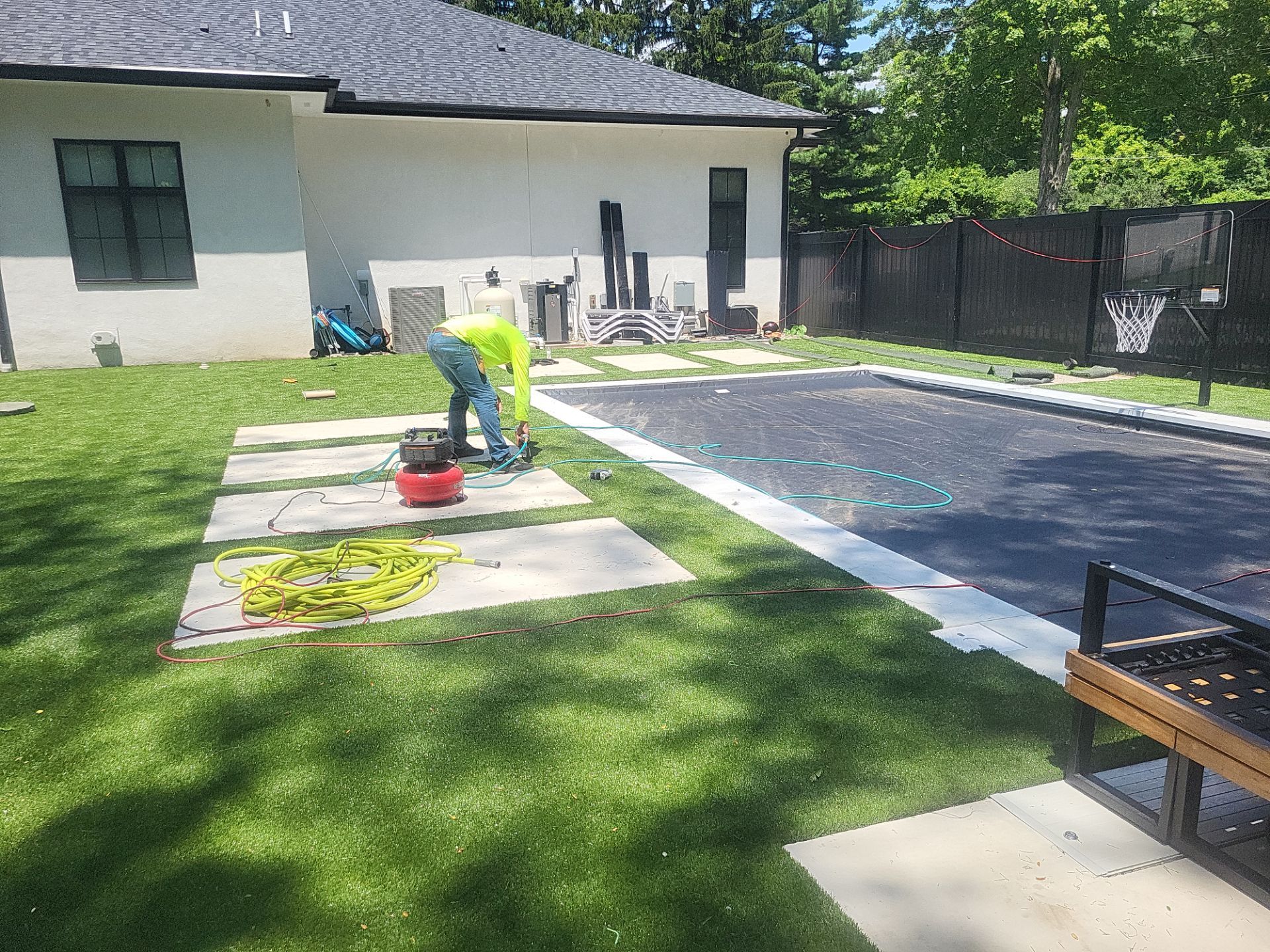 High-End Residential Turf Surrounding Pool in Powell by Southwest Greens Midwest