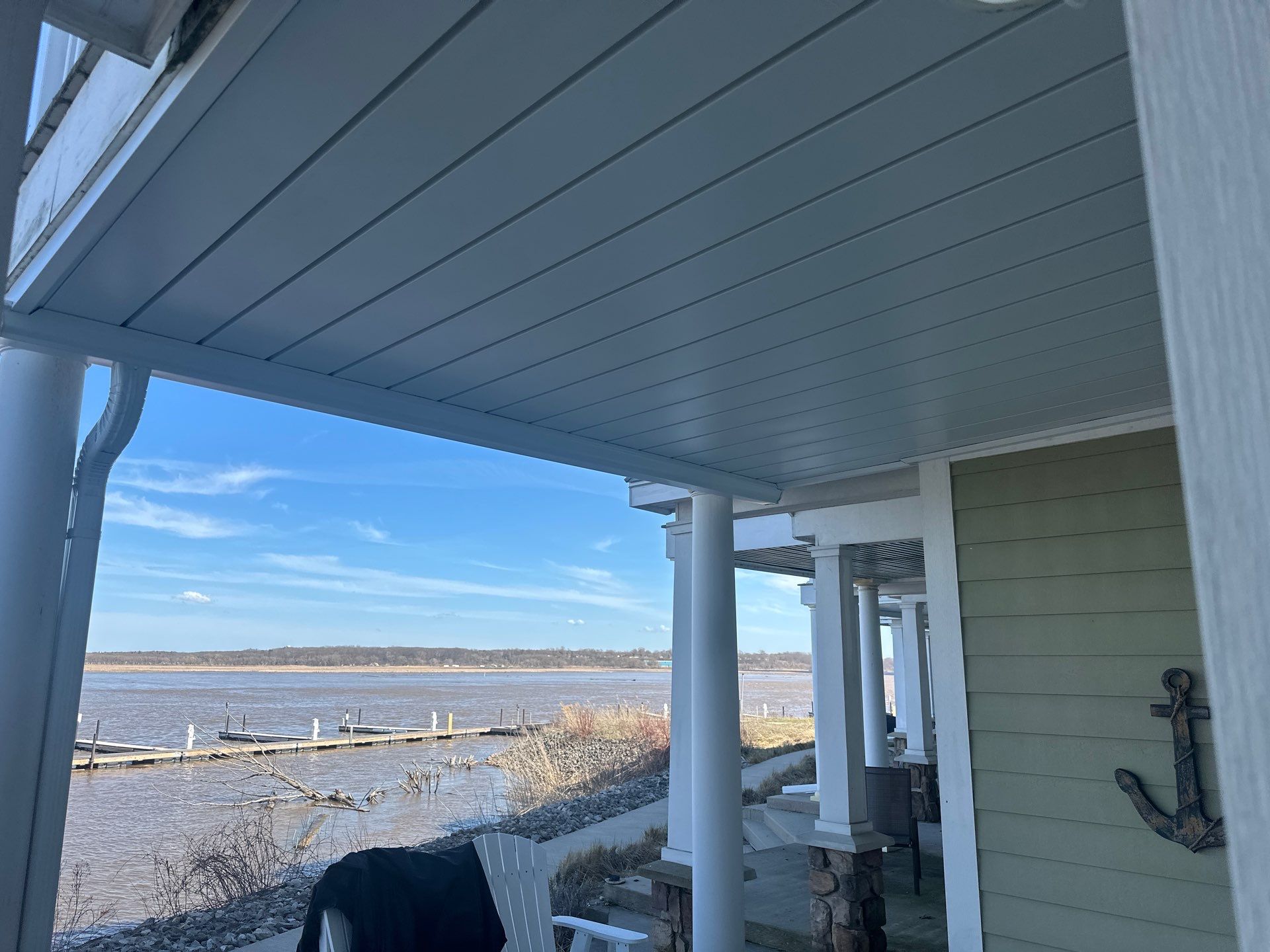 Waterfront Underdeck System Installation and Covered Patio in Manistee by Rainbow Seamless Systems