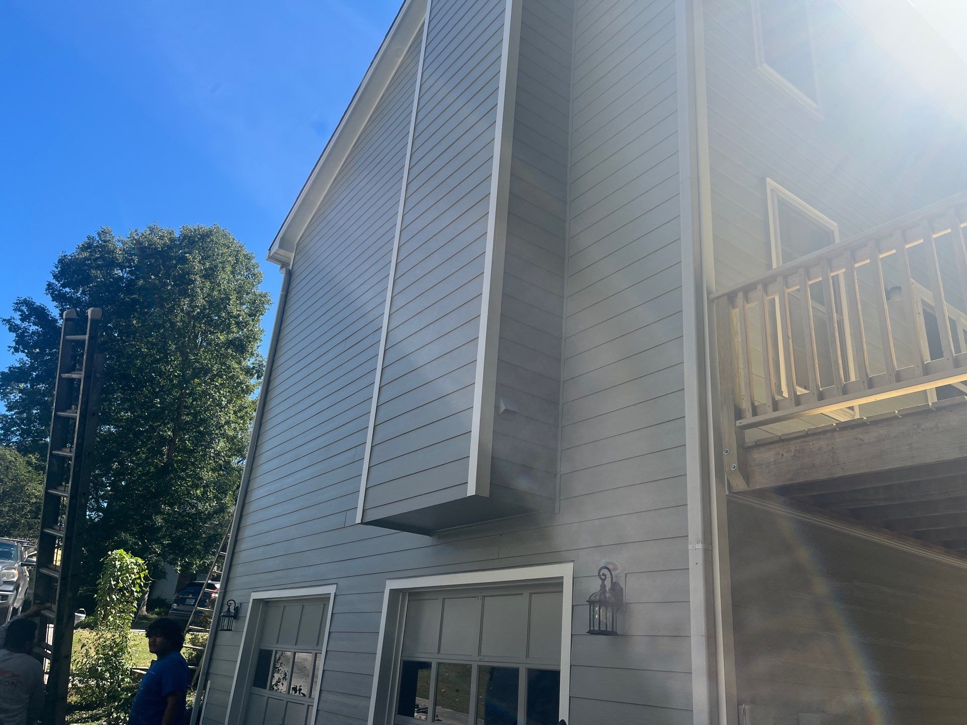 James Hardie Siding Replacement and Pressure Treated Pine Deck Resurface  by Nelson Exteriors 