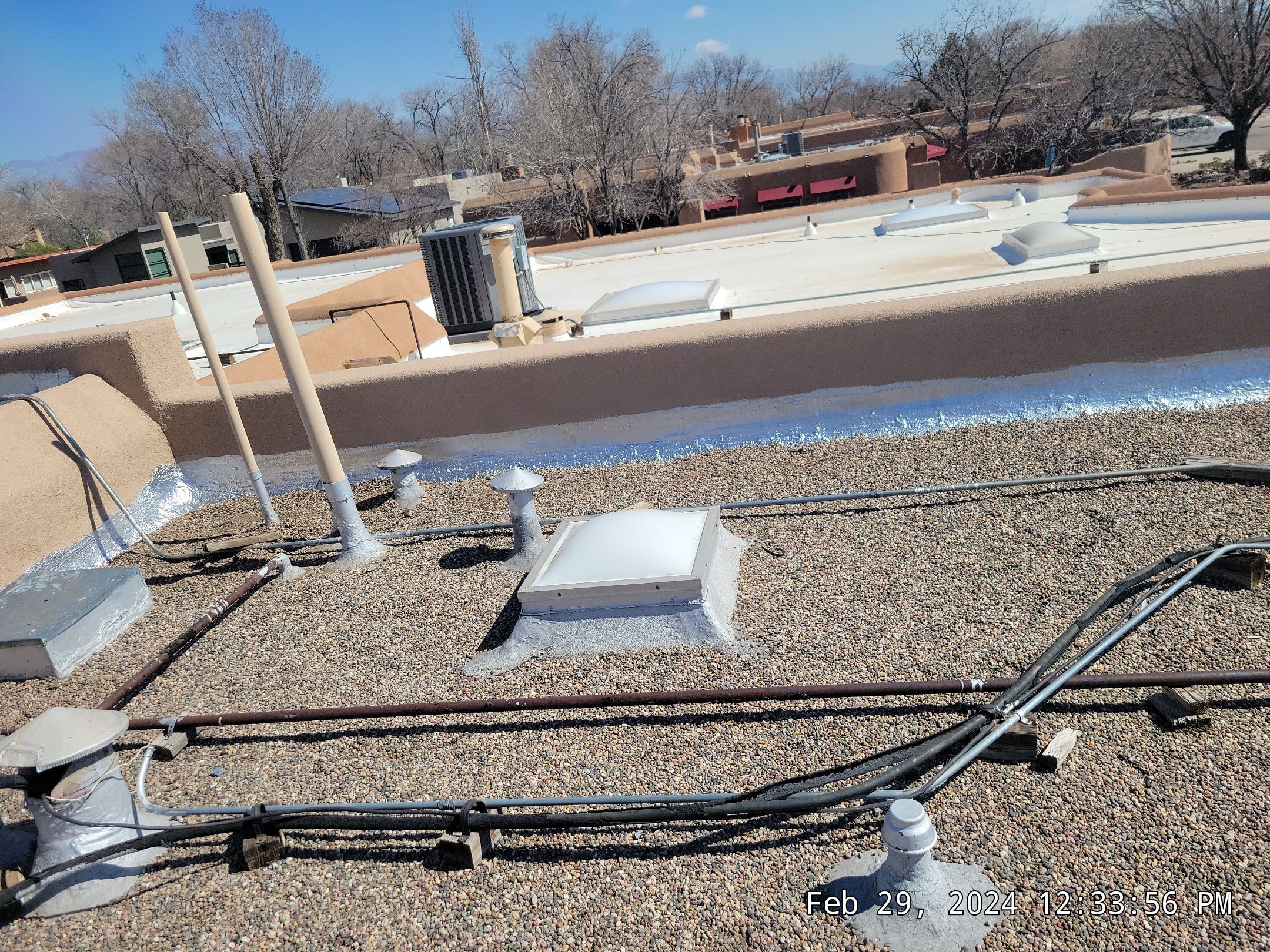 Roof Maintenance and Low-E Tempered Glass Skylight Replacement on Gravel Roof in Northwest Albuquerque by Doyle Roof Masters Inc