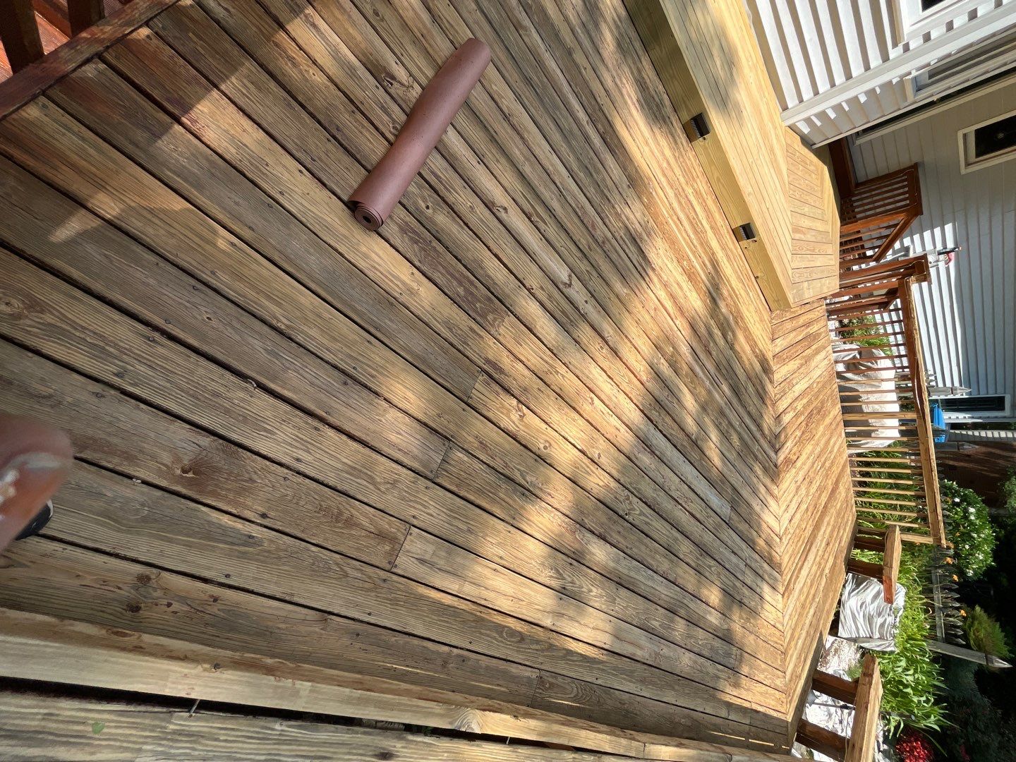 Triple deck re-staining by AKK Painting LLC