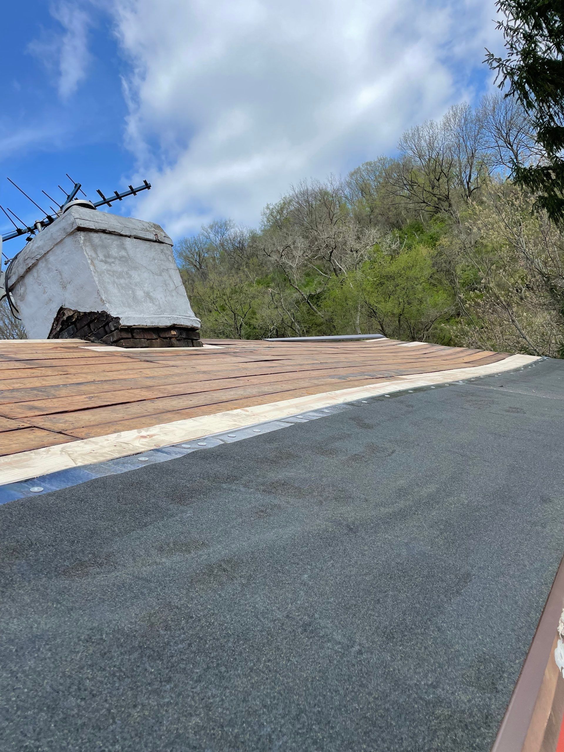 Roof sunspace deck  by Cousins Roofing Siding & Decks