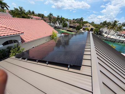 Residential Solar Energy System Installation on Standing Seam Metal Roof