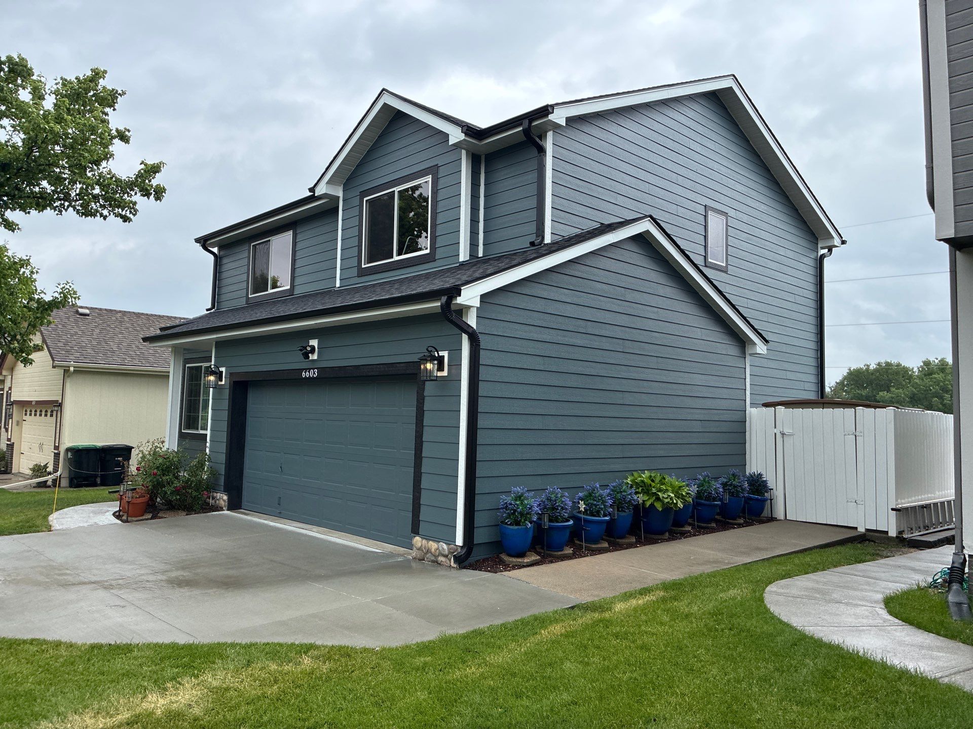 James Hardie Siding and Window Replacement with Arctic White Trim by Carps Complete Exteriors