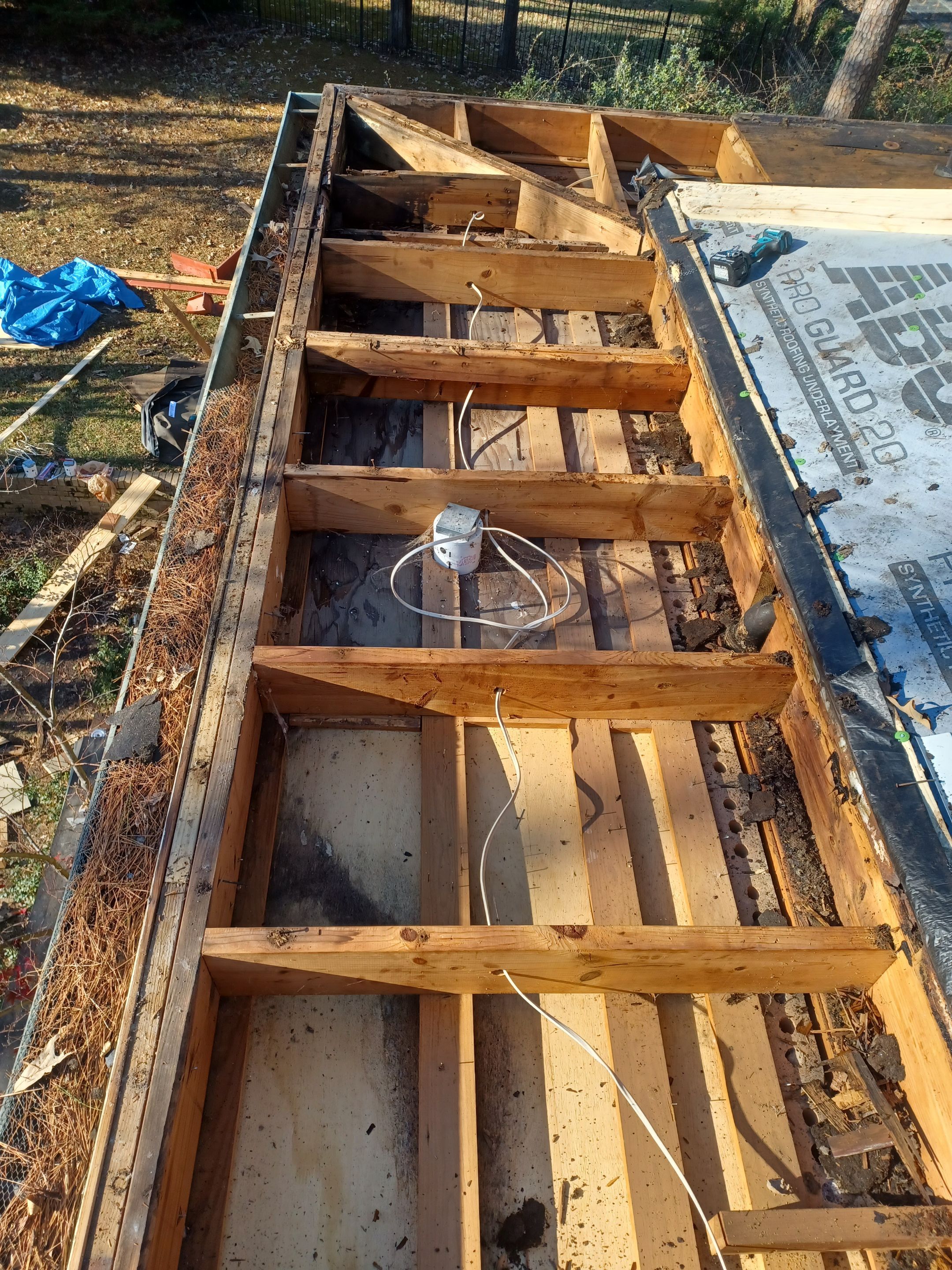 Residential Roofing Installation using PVC membrane and 24 gauge Standing Seam Metal by Hostetler Roofing