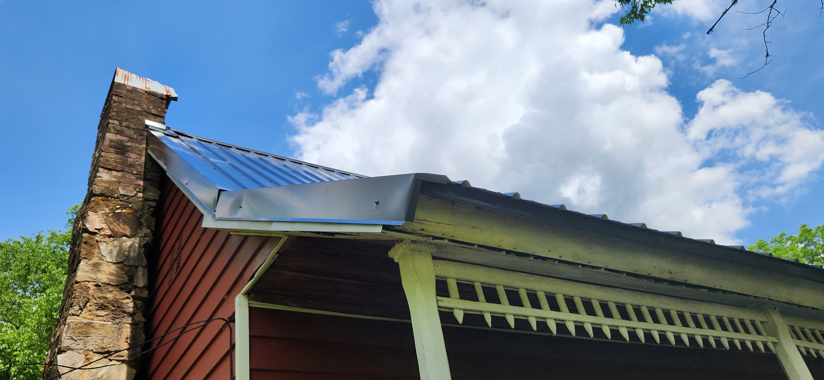 Residential Roofing Installation using 26 Gauge Colored Panels by Hostetler Roofing