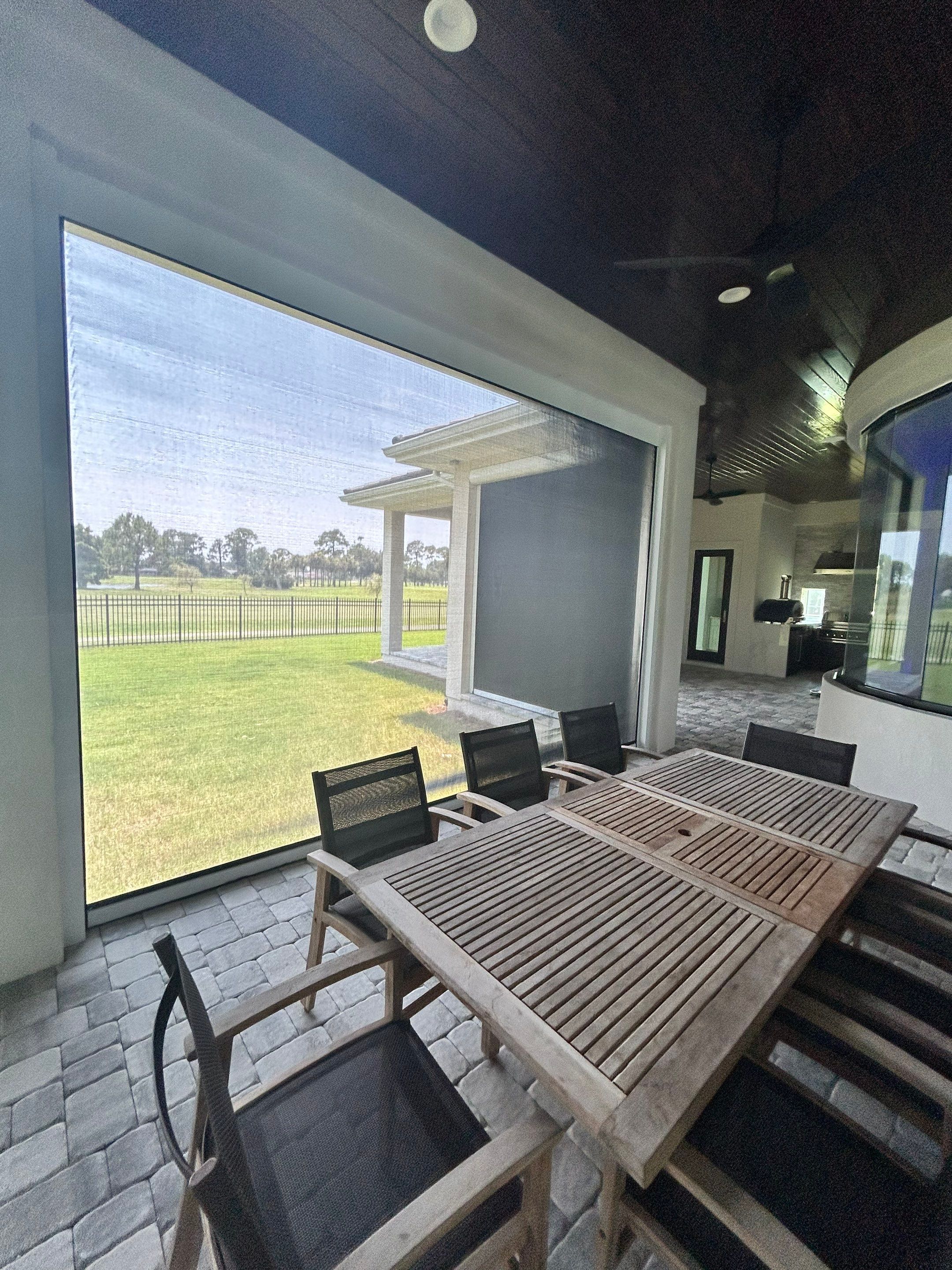 Motorized Screen and Solar Shade Installation in Panama City Beach by Brannan Aluminum Inc.