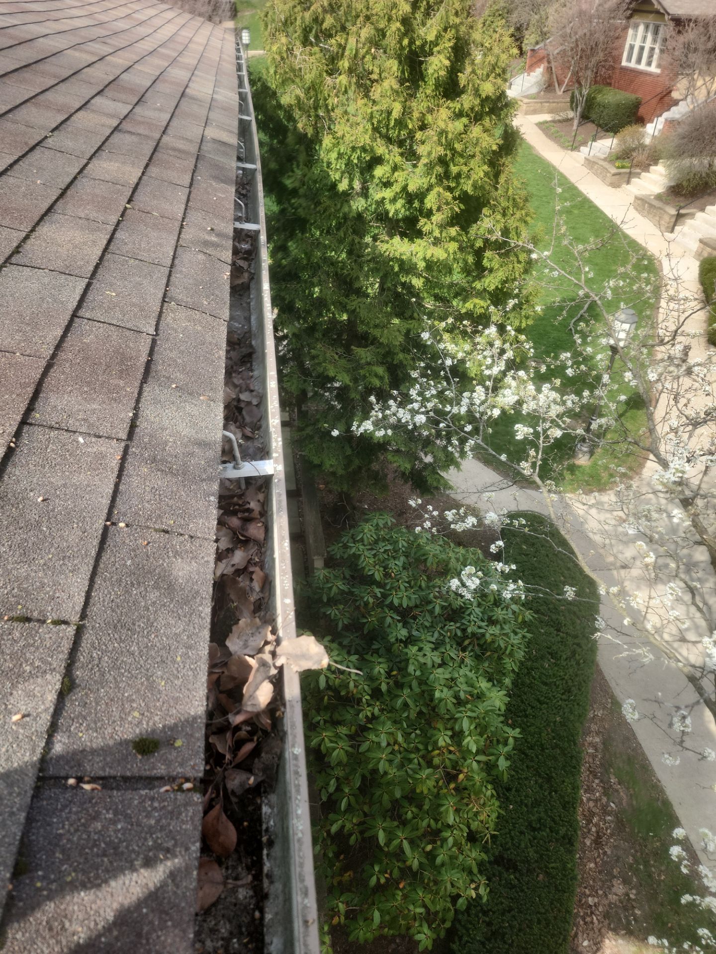 Commercial gutter cleaning Pittsburgh, PA before photo with filled gutters