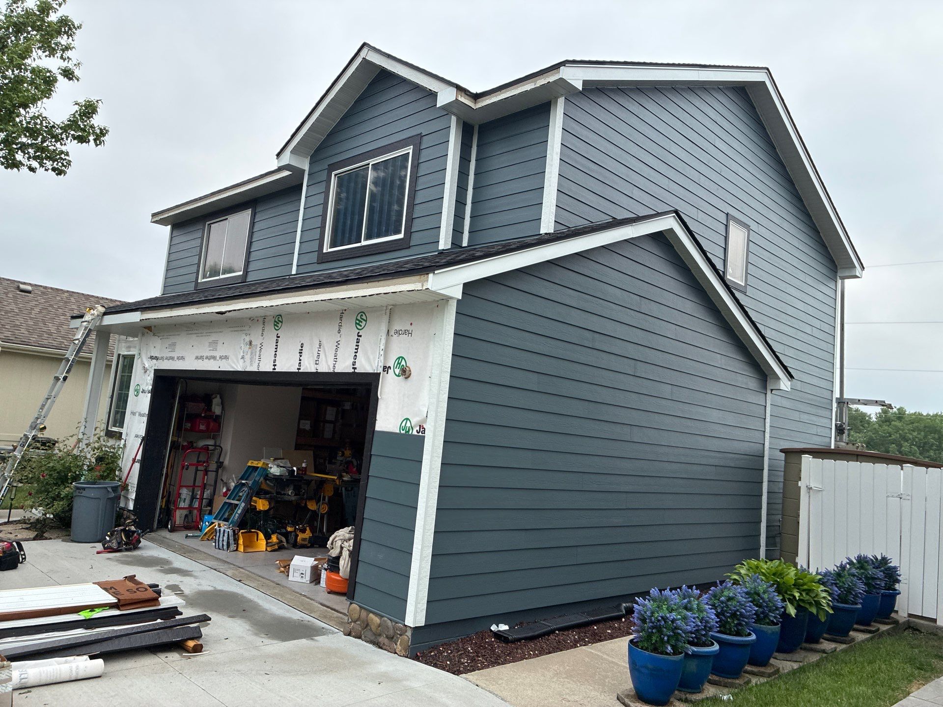 James Hardie Siding and Window Replacement with Arctic White Trim by Carps Complete Exteriors