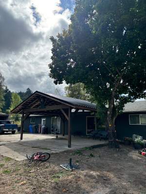 Custom Timber Frame Patio Cover with Black Metal Roof
