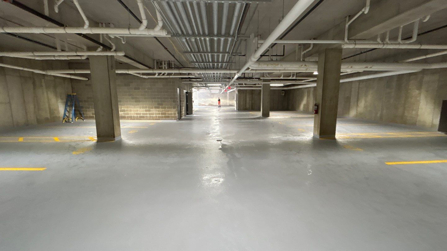 Parking garage using Hot water by Northern Power Washing LLC.