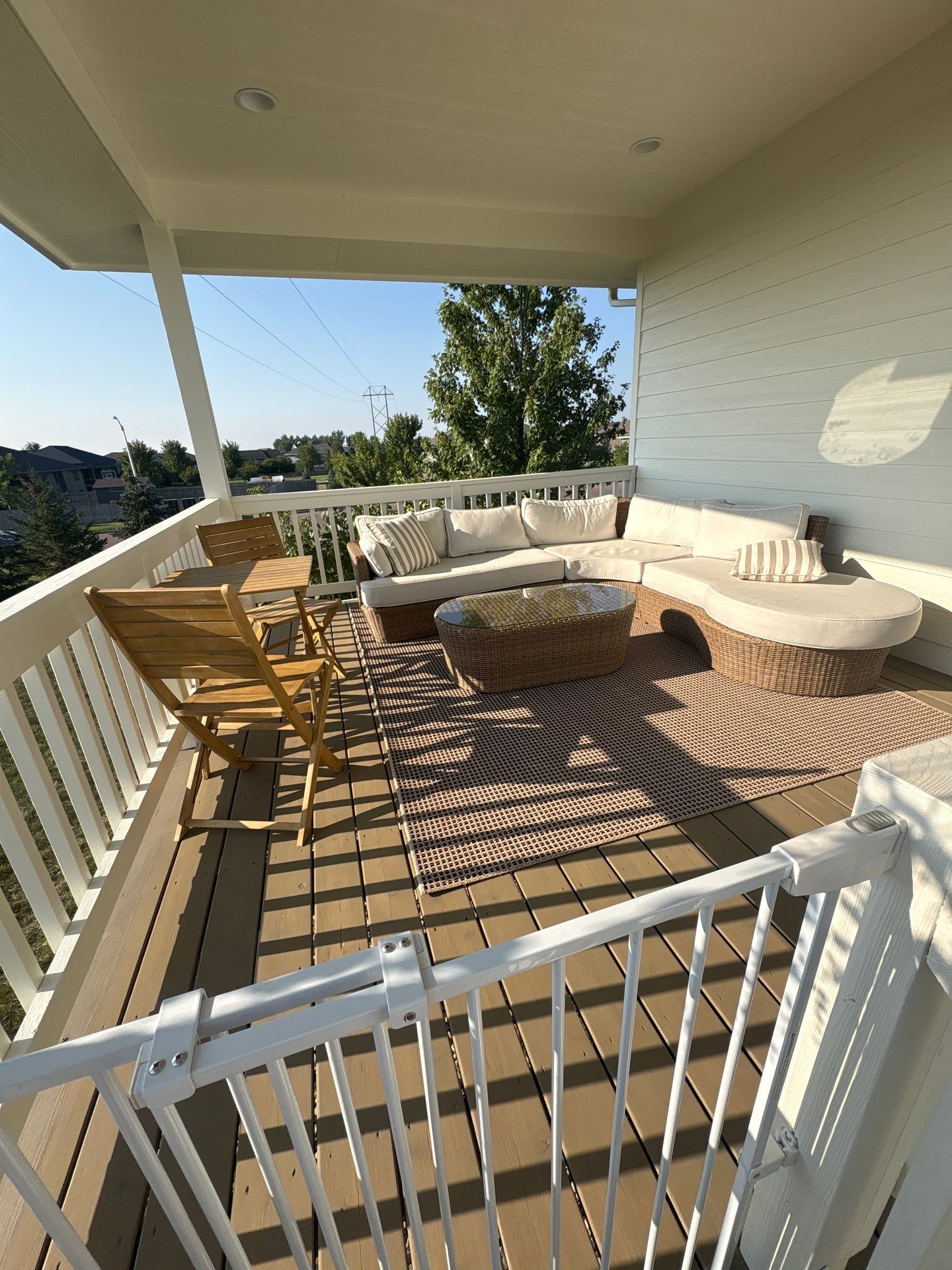 Sioux Falls Exterior Residential Siding and Deck Painting Project by Select Painting, Coatings & Garage Cabinets