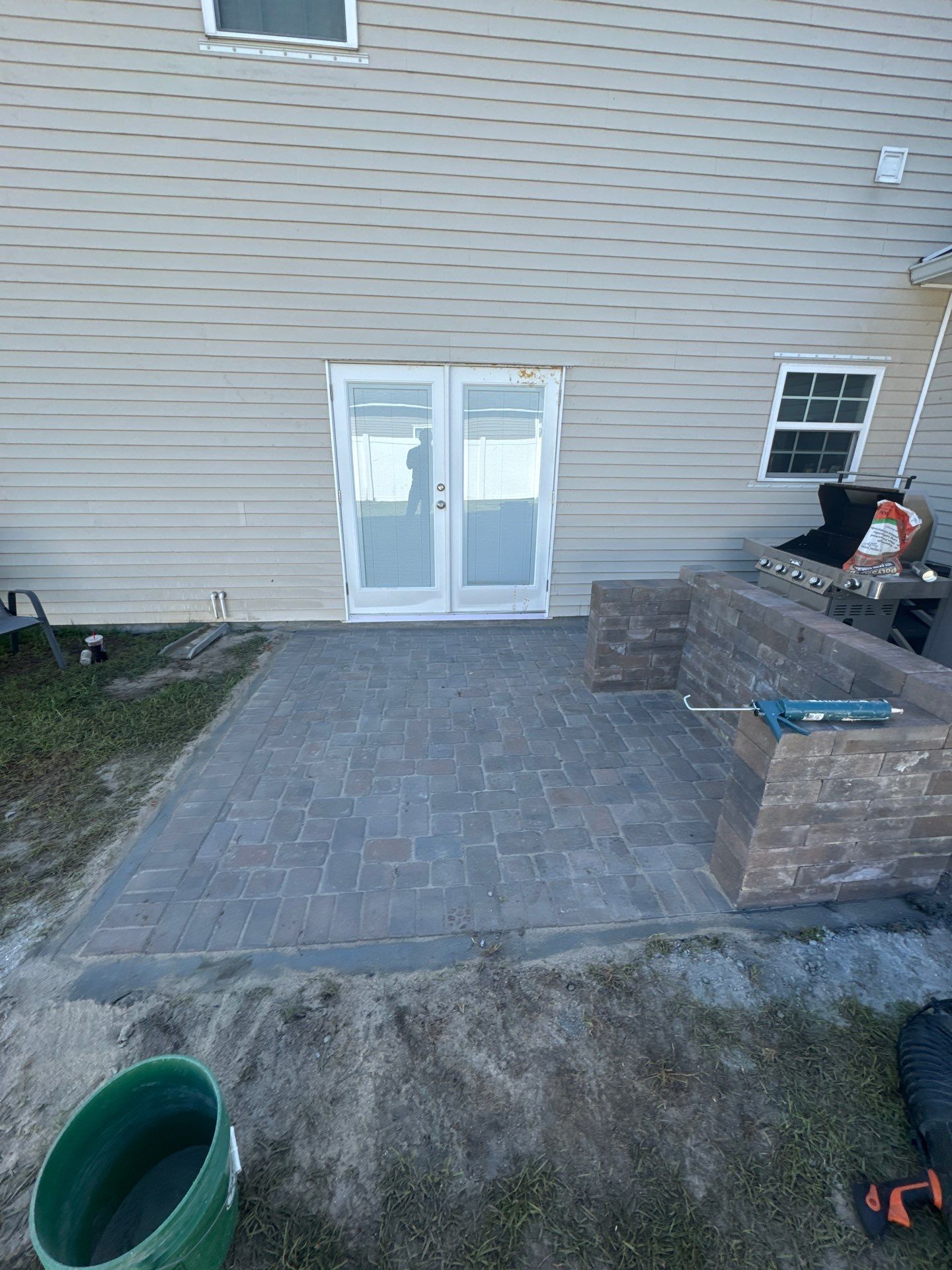 Custom Herringbone Paver Patio and Retaining Wall in Bluffton by Lowcountry Scapes, LLC