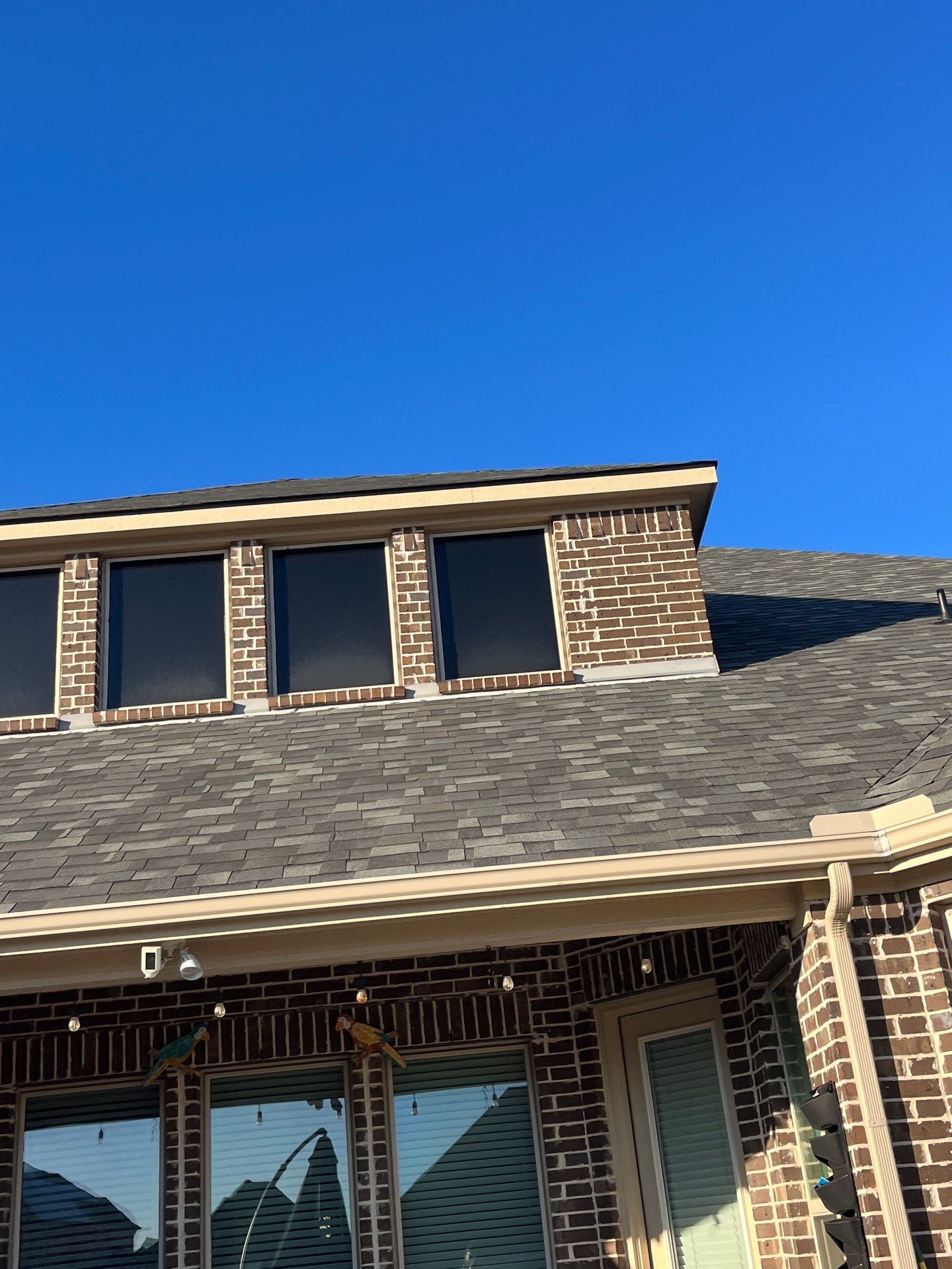 Red Brick with Malarkey Storm Grey by Tejas Roofworks + Restoration