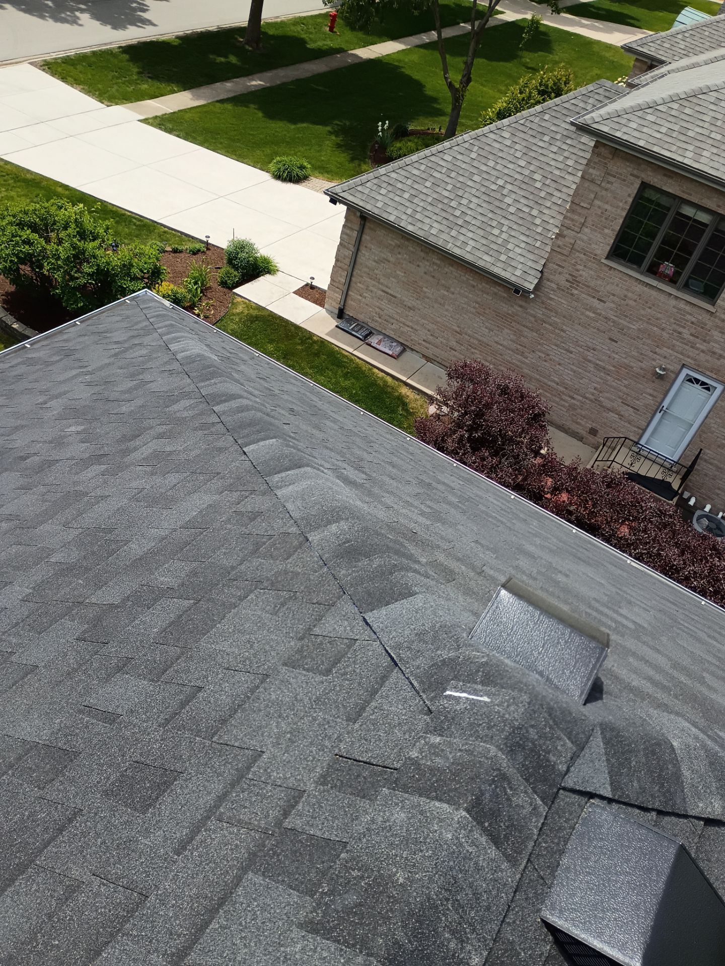 Asphalt Shingle Roof Replacement and Skylight Installation in Darien by Pro Home Services Inc