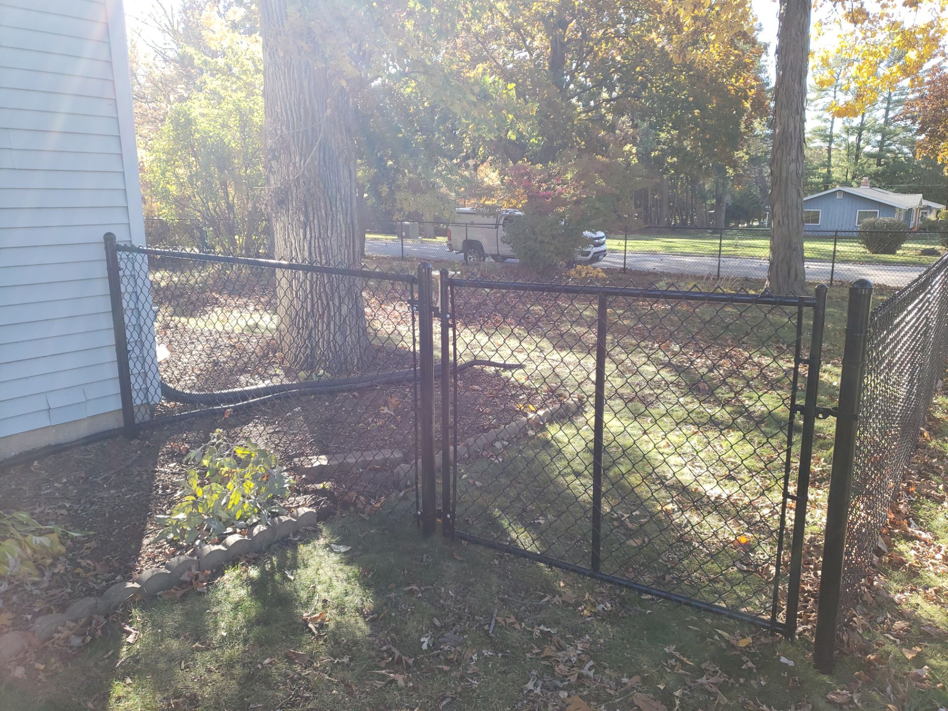 Black Chain Link Fence Installation in Cedar Falls, Iowa by Perfect Picket Fence and Stain