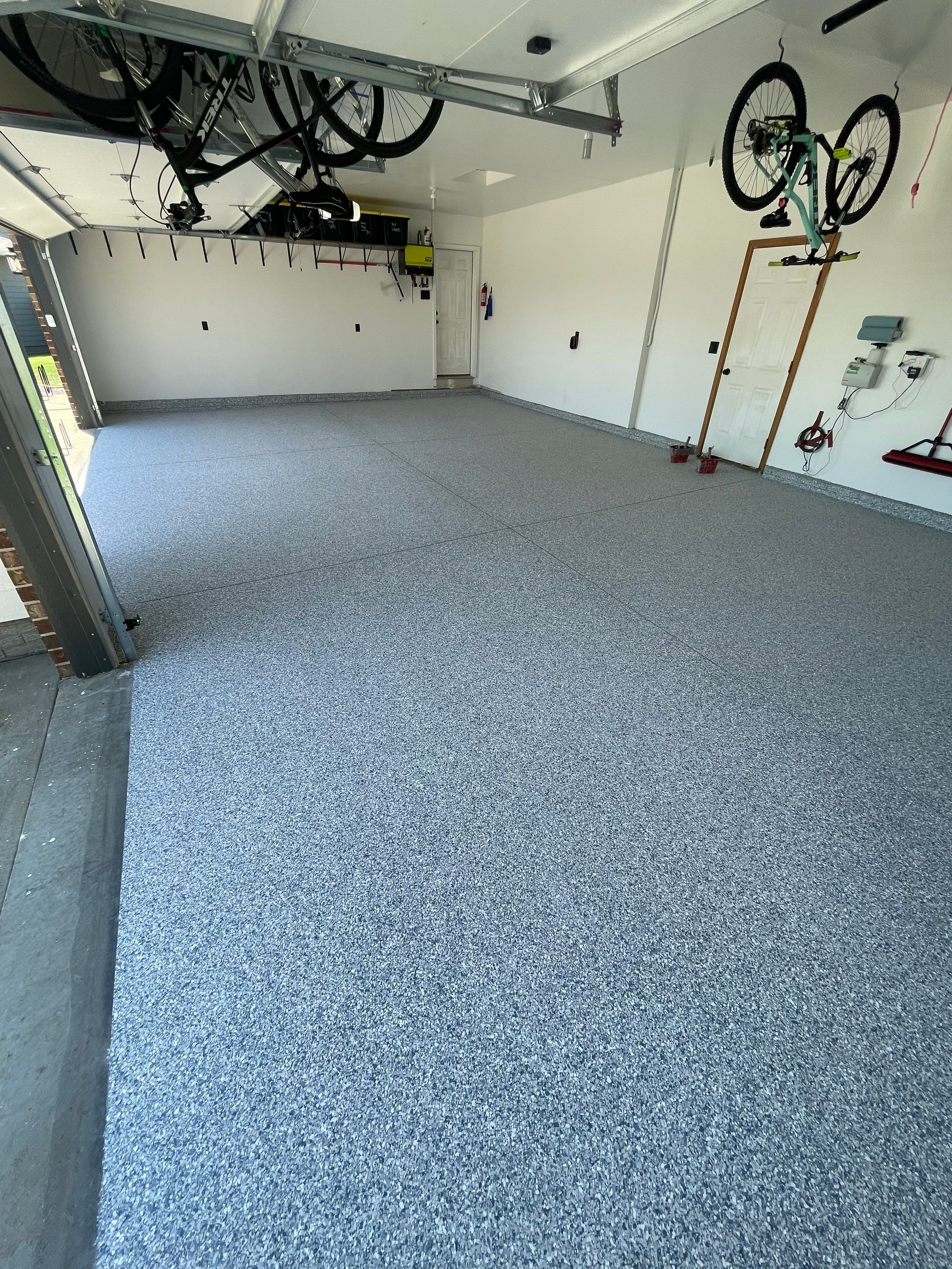 Tidal Wave Flake Garage Floor Installation in Sioux Falls by Select Painting, Coatings & Garage Cabinets