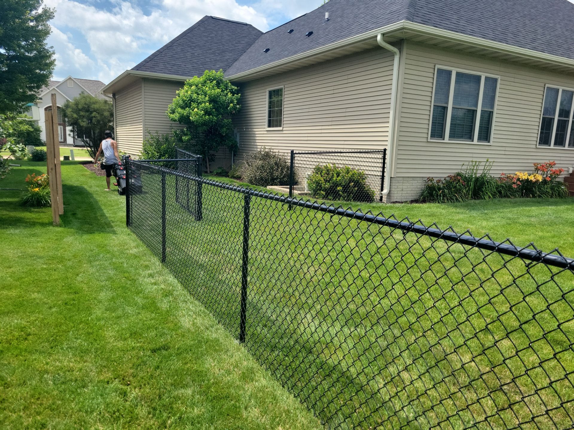 Black Vinyl Coated Chain Link Fence Installation in Cedar Falls by Perfect Picket Fence and Stain