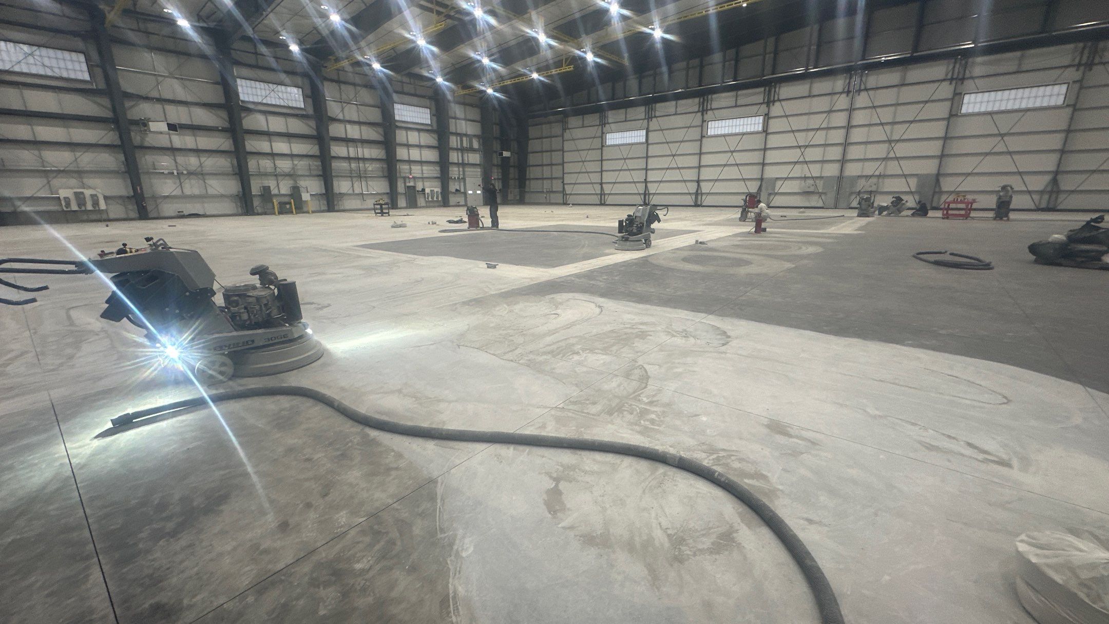 Airplane Hanger using Light Grey Commercial Penntek Epoxy by Croc Coatings, LLC