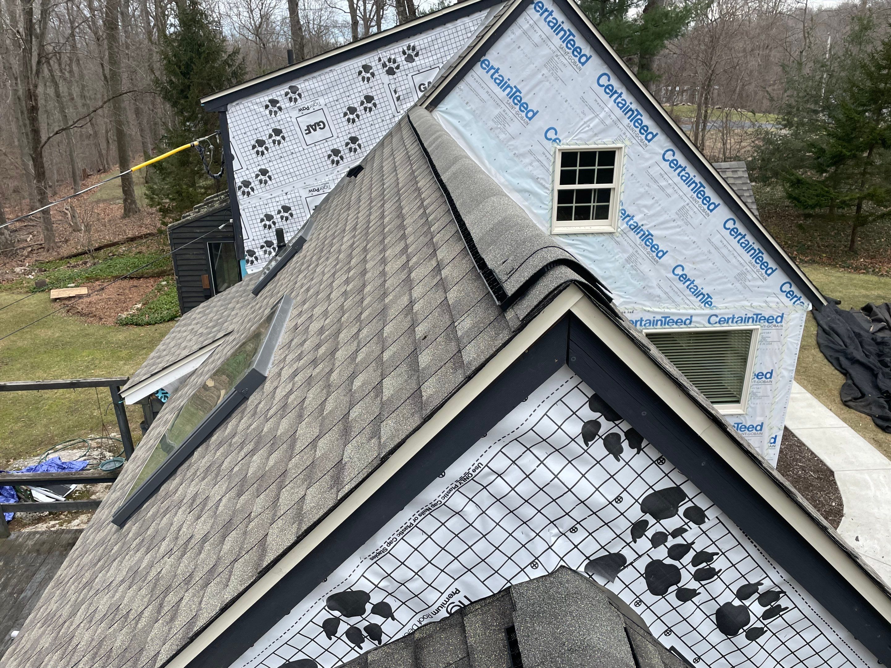 Asphalt shingles meet sleek siding in Guilford. by DiGiorgi Roofing and Siding Inc
