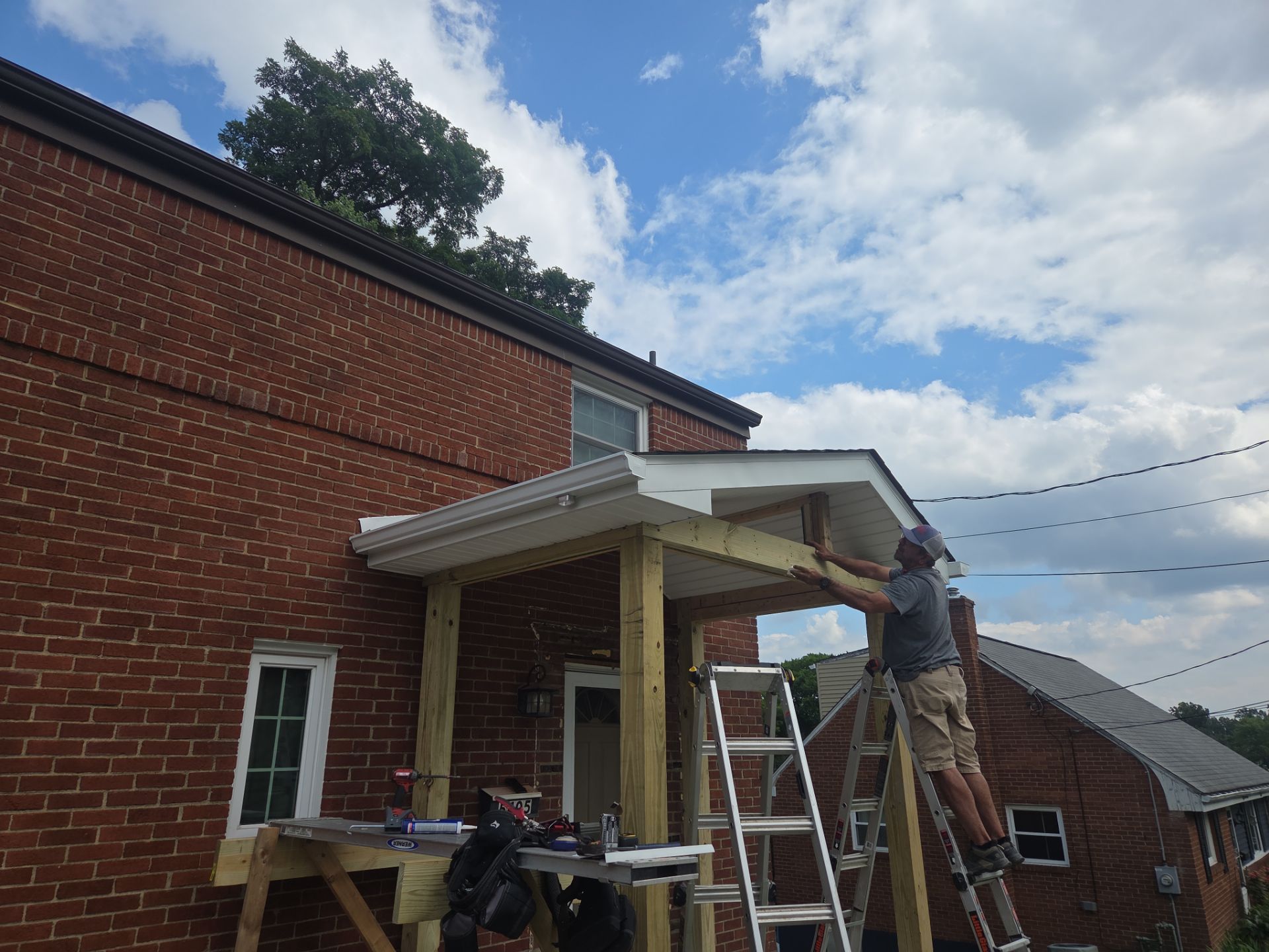 Concret and roof build  by Cousins Roofing Siding & Decks