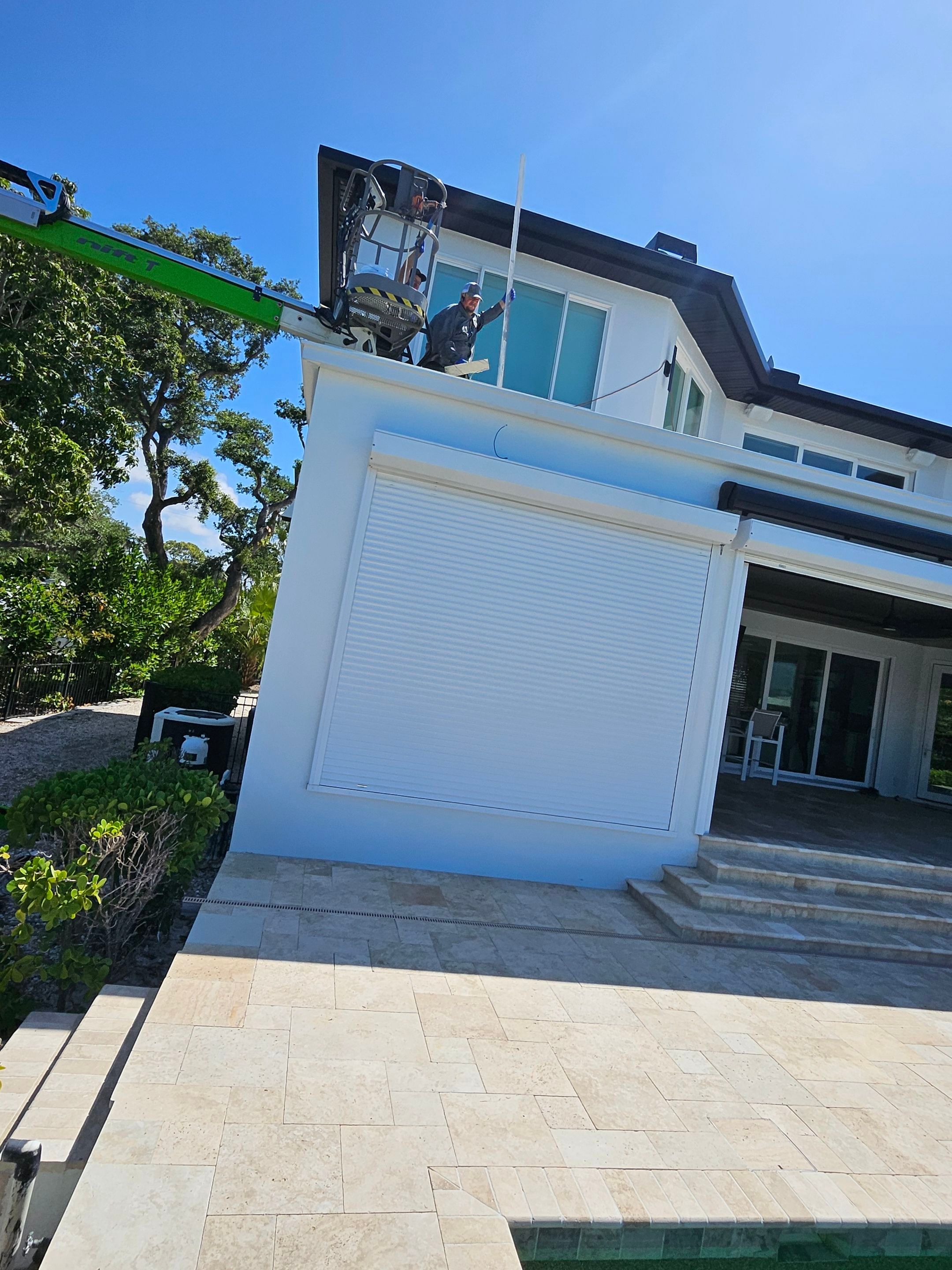 Soffit and Fascia Installation and black seamless gutters in Sarasota FL by Gutter Professors