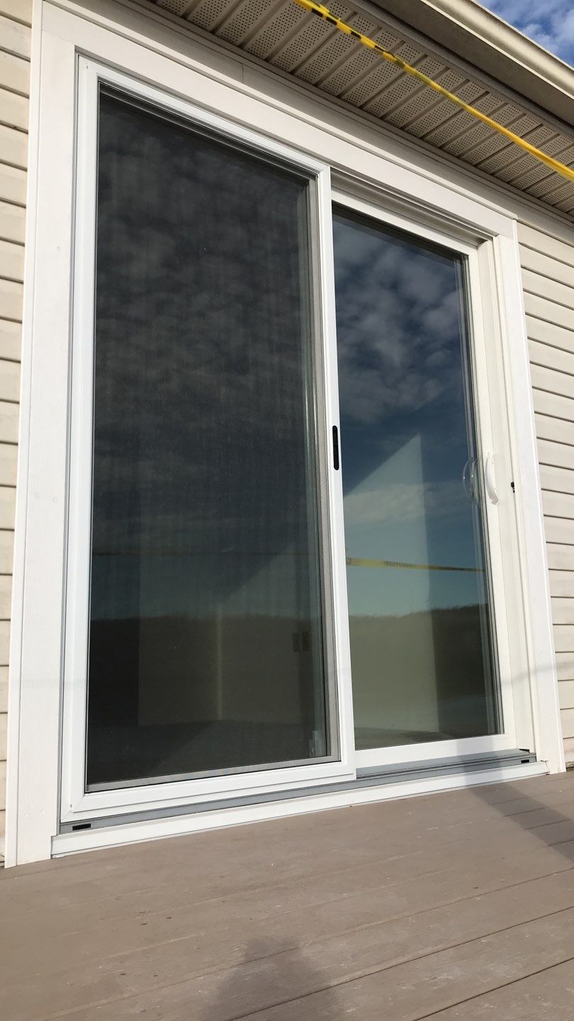 Deck Refurbush and Door Replacement using Trex Decking and Railing. Polaris Patio Doors by Secure Construction Company Inc