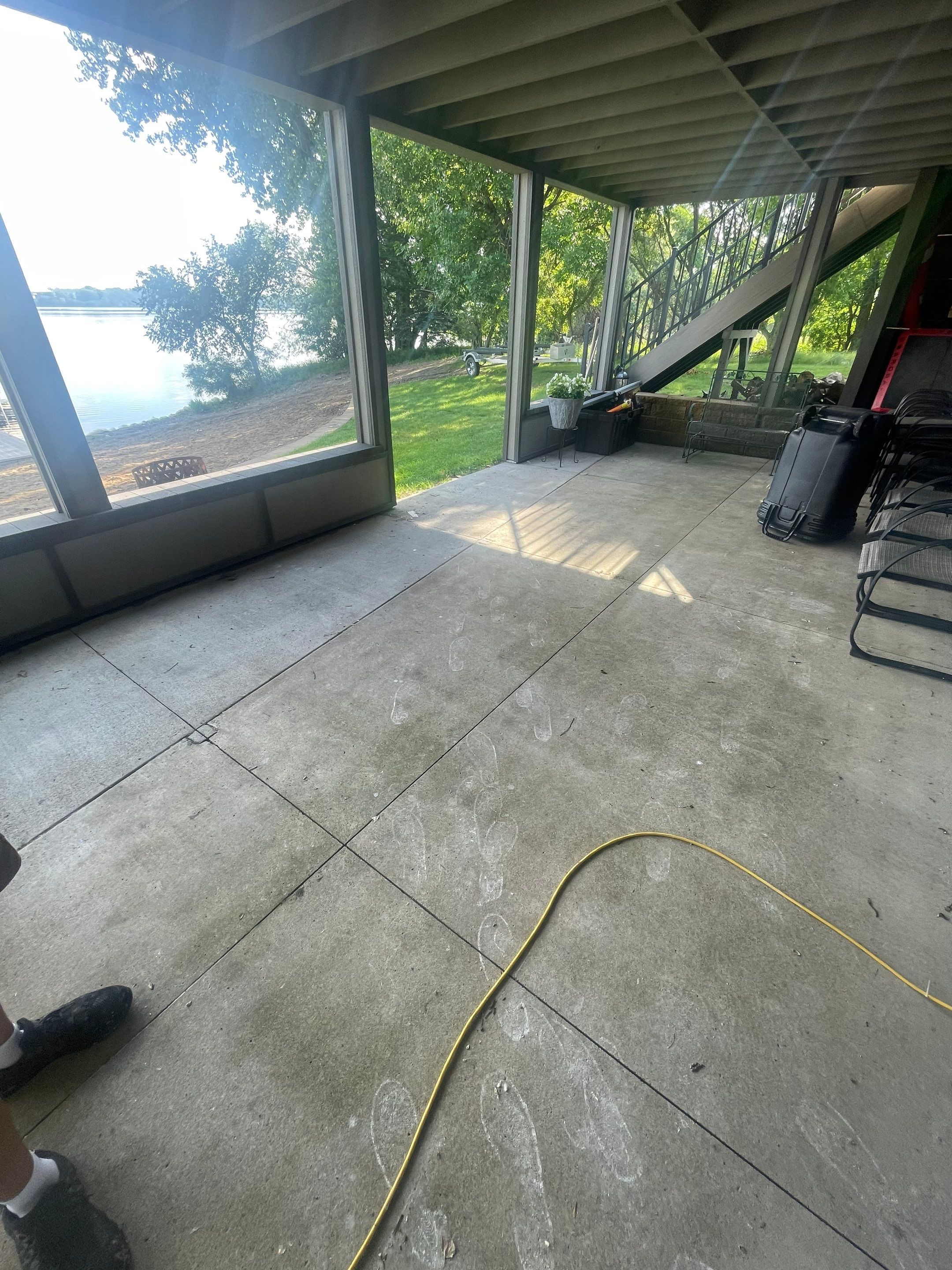 Lakefront Screened Patio Concrete Coating Installation in Wentworth by Select Painting, Coatings & Garage Cabinets
